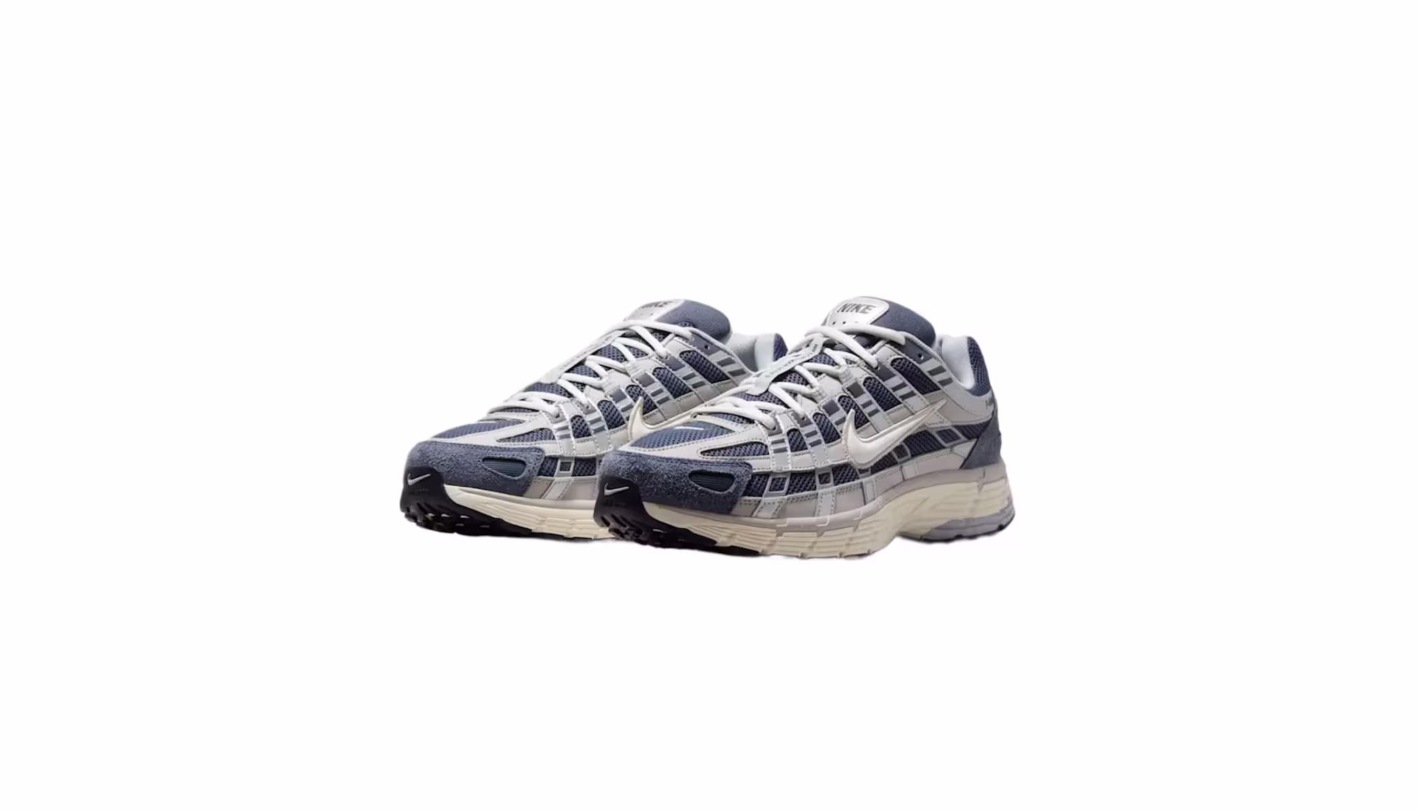 A pair of blue and beige Nike sneakers with a mesh and synthetic upper, featuring a distinctive swoosh logo on the side.