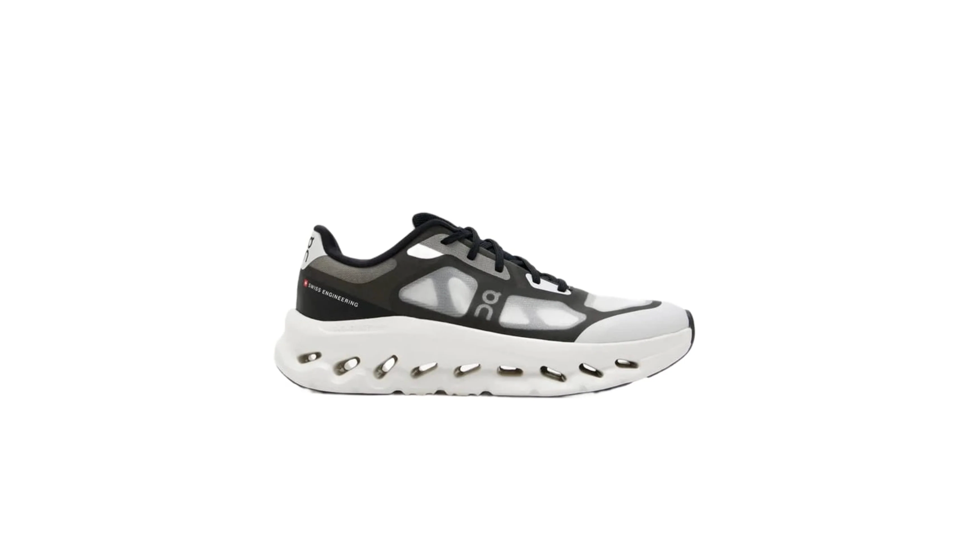 A black and white athletic shoe with a distinctive sole design, featuring mesh panels and branding on the side.