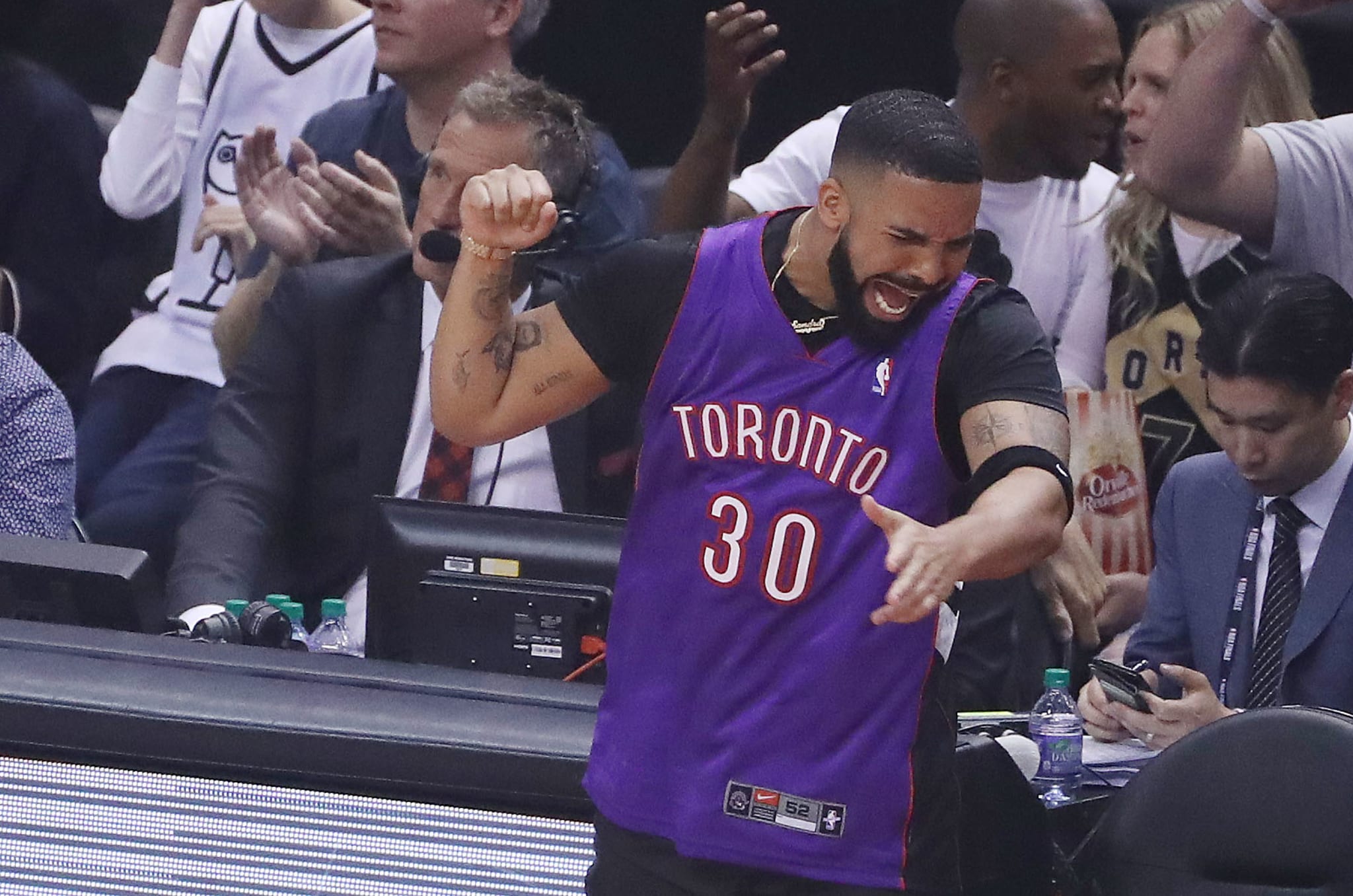 Drake celebrates during game one of the 2019 NBA Finals. 