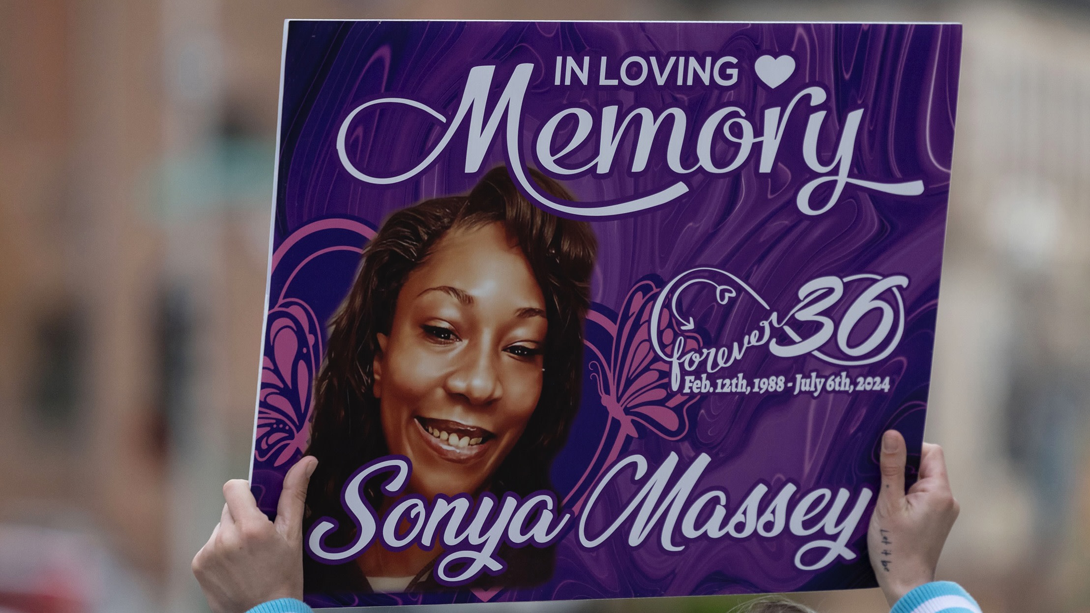 Rallies outside the Peoria County Courthouse on Oct. 22, 2025, on the first day in the trial of Sean Grayson, officer who killed Sonya Massey.