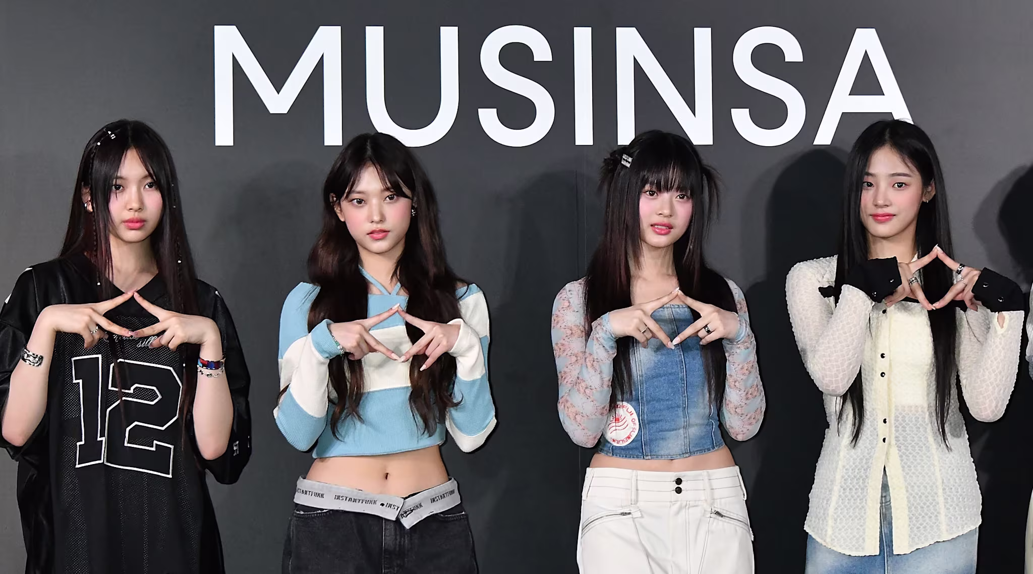 (L-R) HYEIN, HAERIN, HANNI, and MINJI of K-pop group NewJeans attend the photocall for MUSINSA Pop-up Store Opening Ceremony on April 6, 2023 in Tokyo, Japan. 