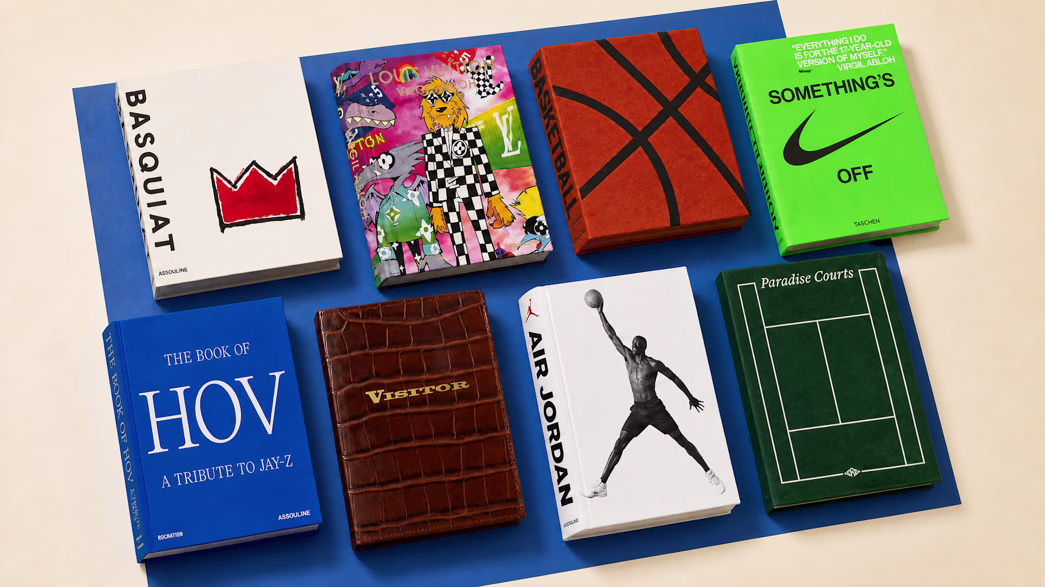 Seven art and design books displayed on a blue background, featuring covers about Basquiat, Louis Vuitton, basketball, Nike, Jay-Z, crocodile leather, and Air Jordan.