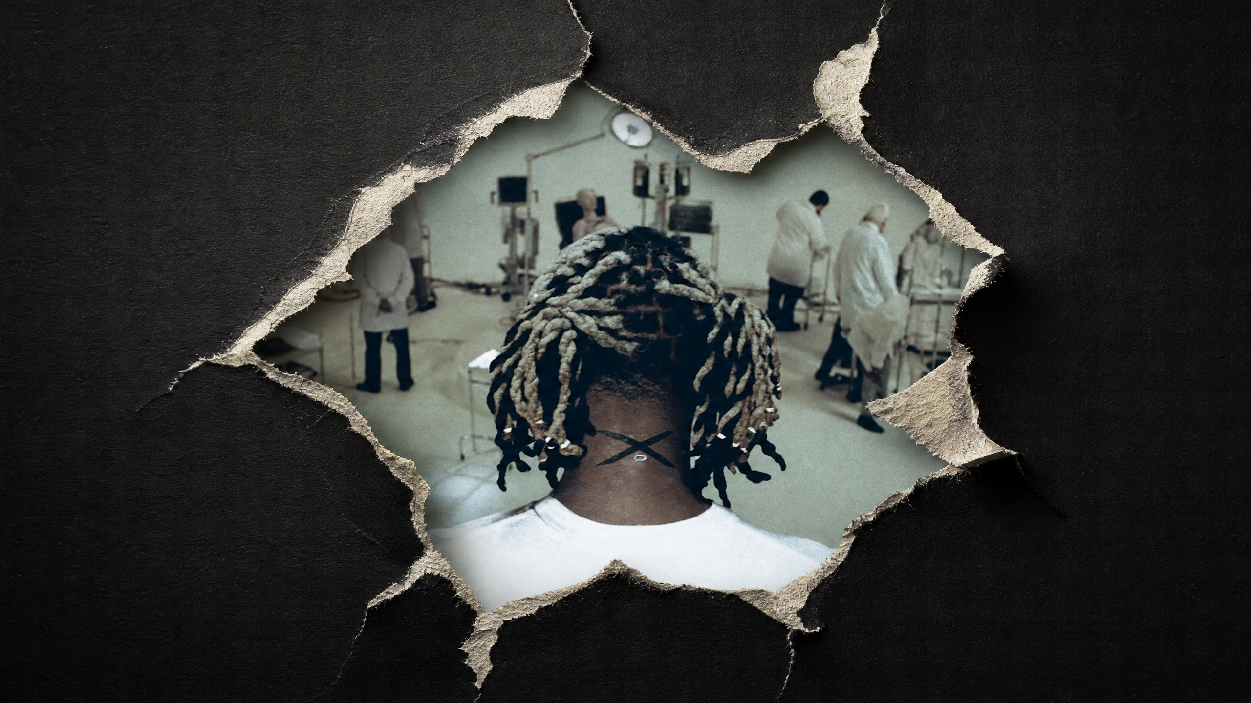 A person with braided hair is viewed from behind through a torn paper hole, revealing a laboratory scene with people in lab coats.