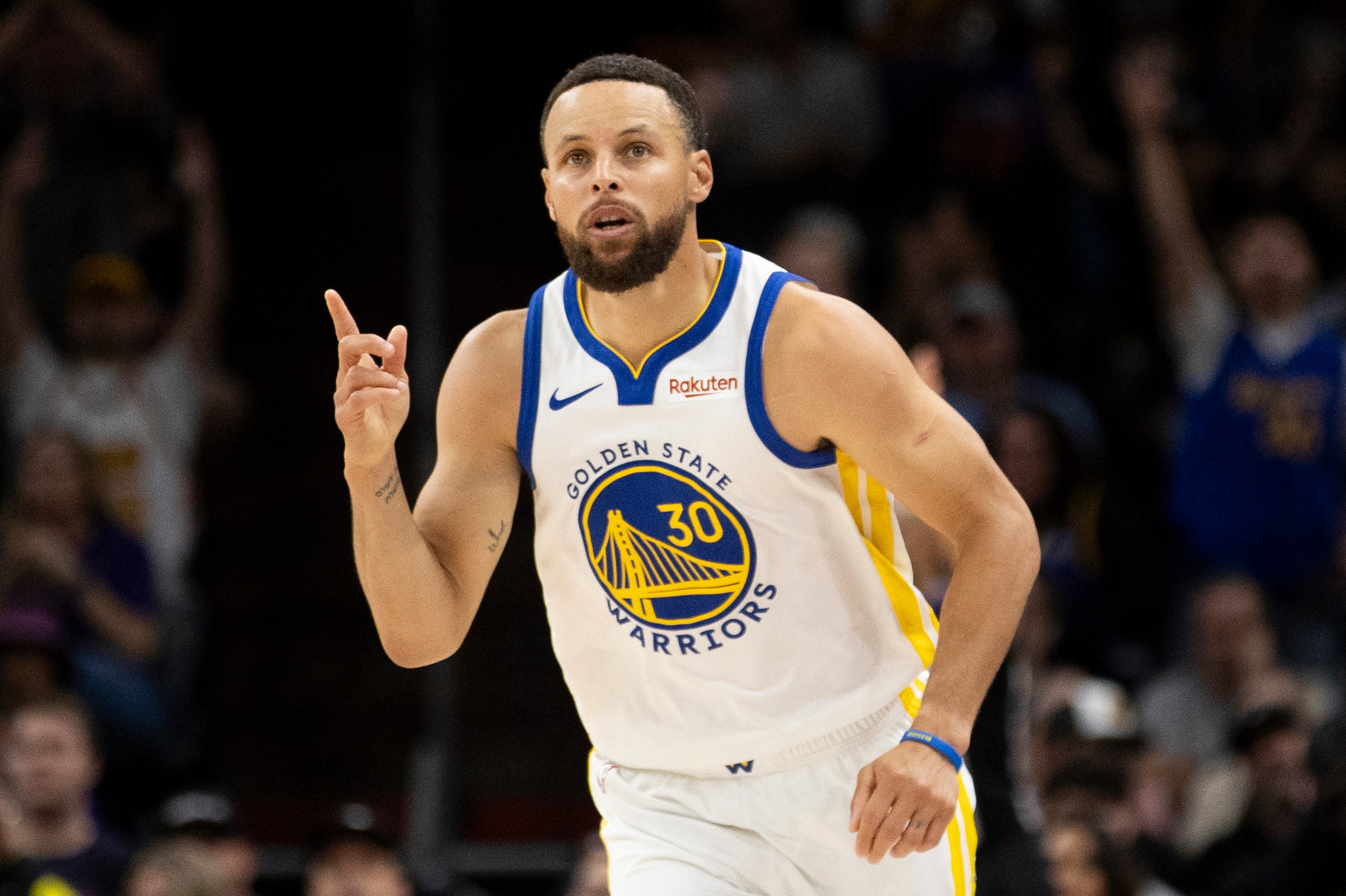 Steph Curry celebrates after hitting a 3-pointer during a play-in game between the Golden State Warriors and Phoenix Suns. 