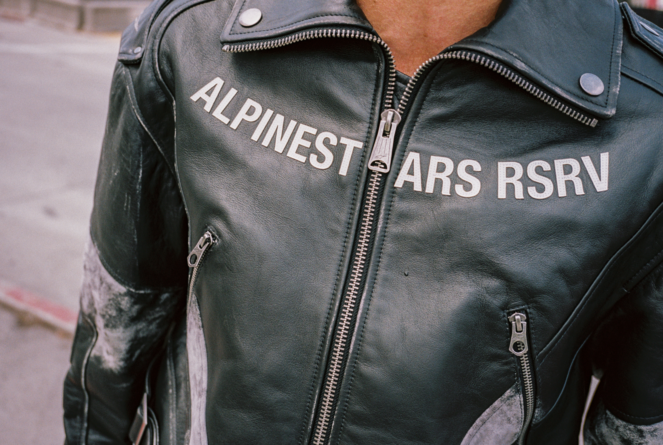 A closeup of a leather biker jacket by Alpinestars RSRV.