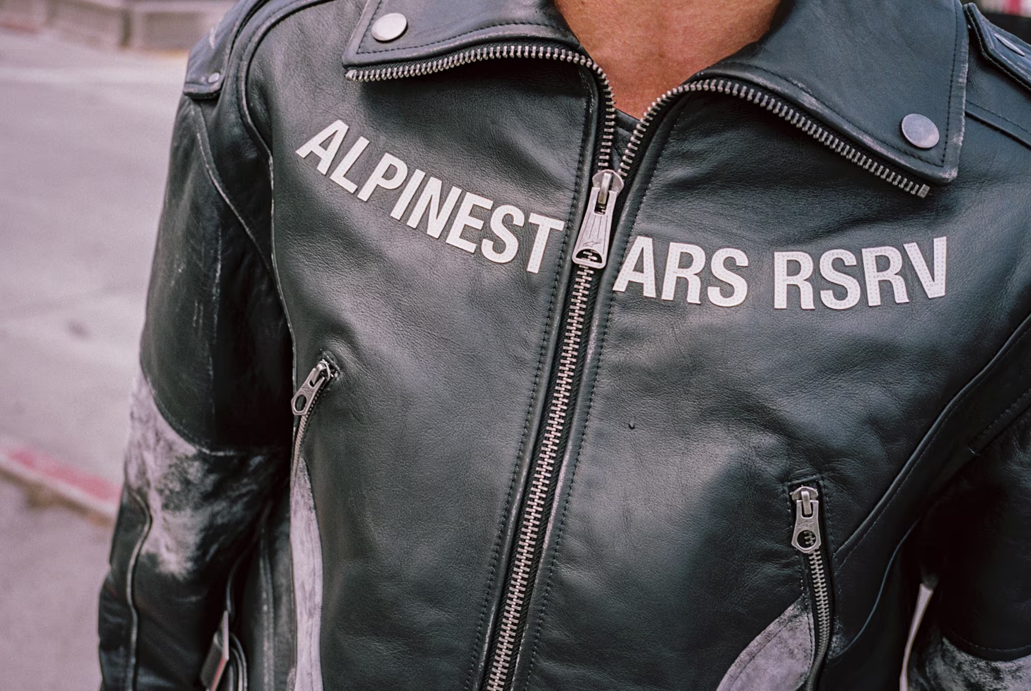 A closeup of a leather biker jacket by Alpinestars RSRV.