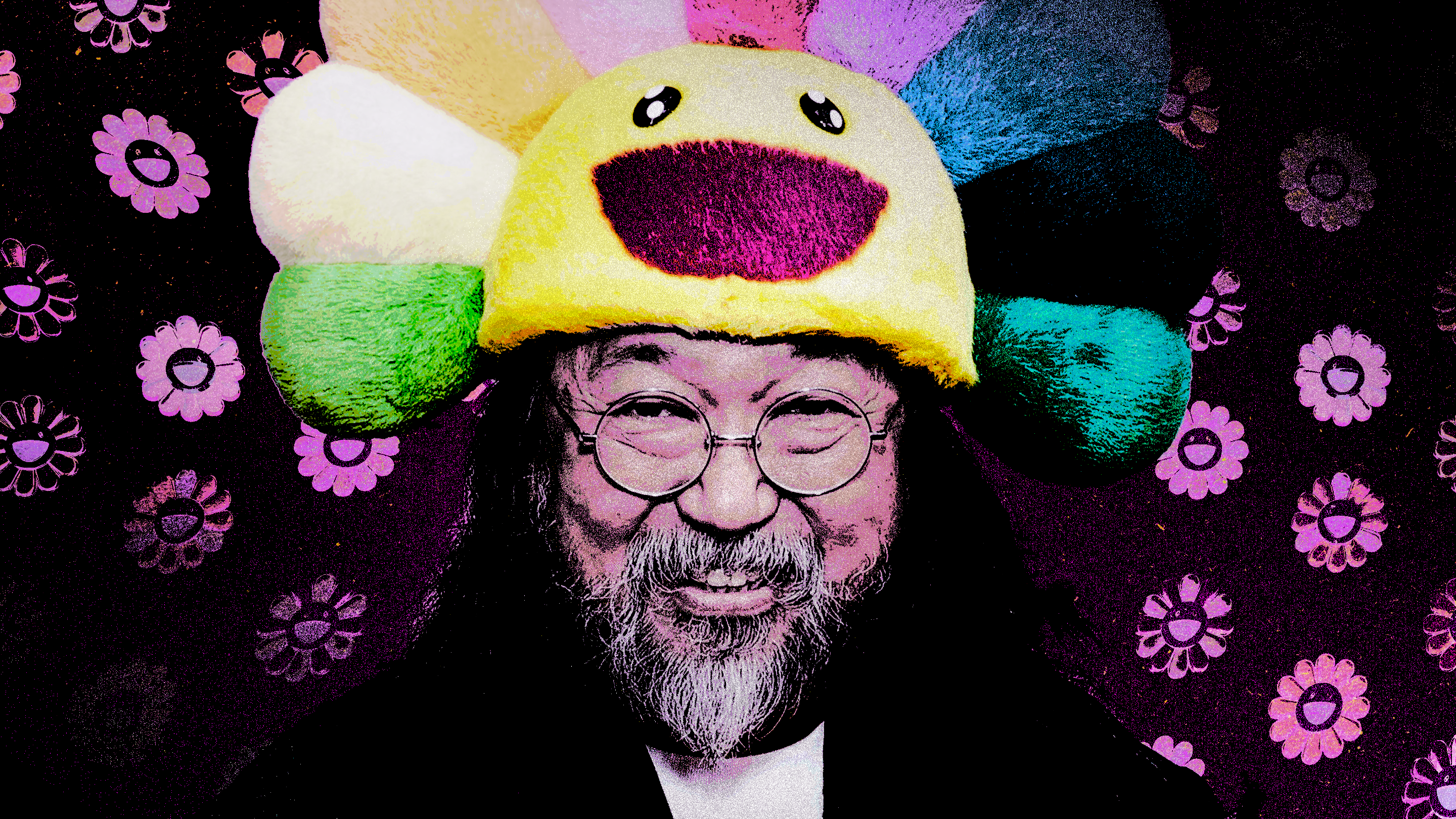 Takashi Murakami wearing a colorful, smiling flower hat with a patterned floral background.