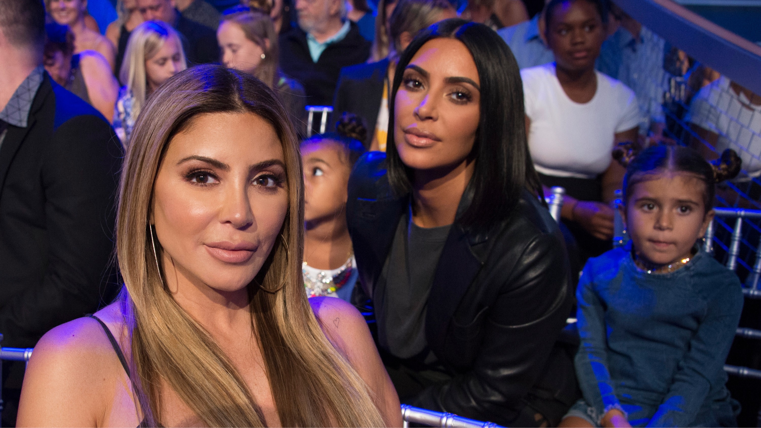 Larsa Pippen and Kim Kardashian pose at an event.
