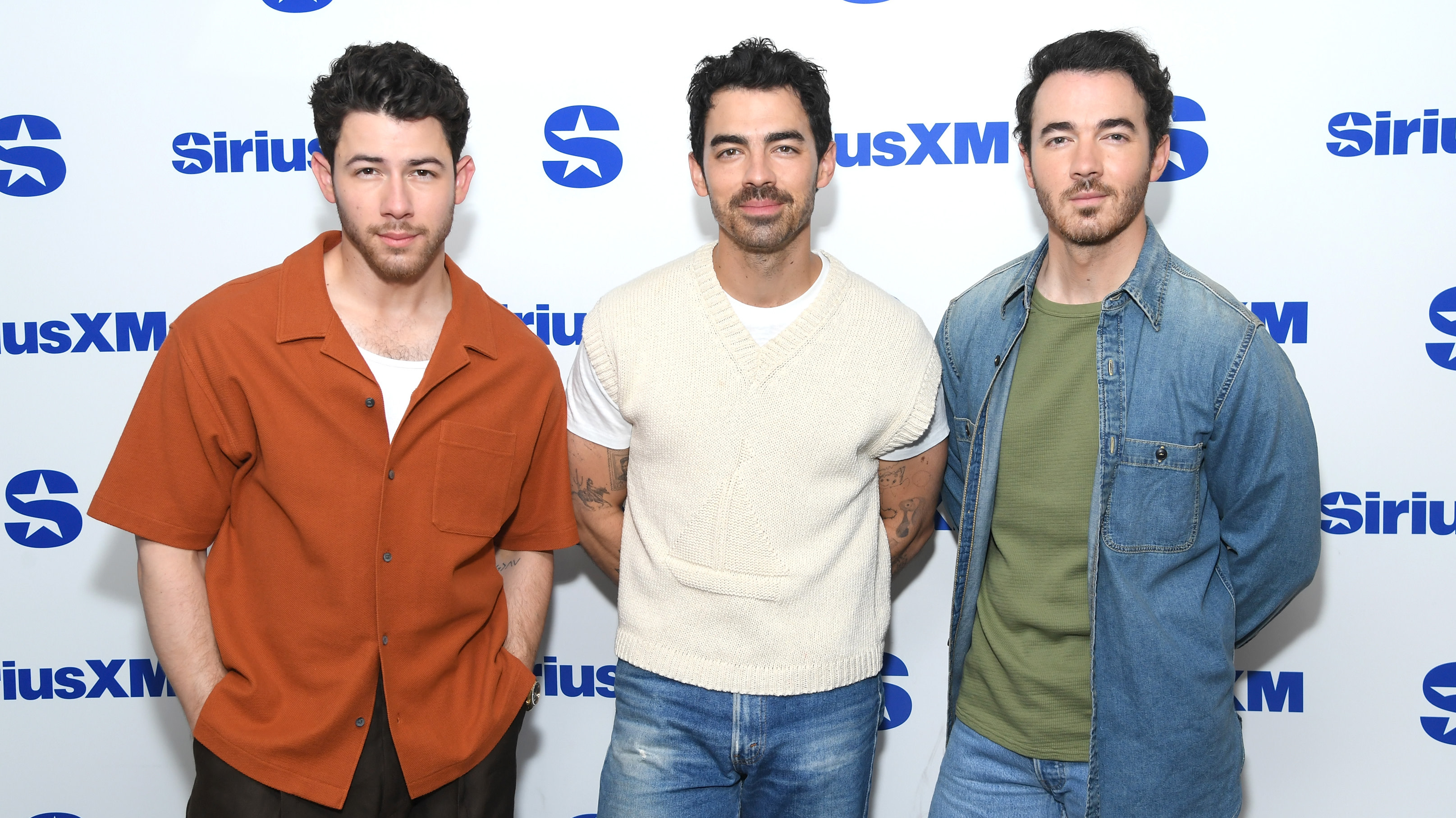  Nick Jonas, Joe Jonas and Kevin Jonas of the band Jonas Brothers visit SiriusXM Studios on June 18, 2025 in New York City.