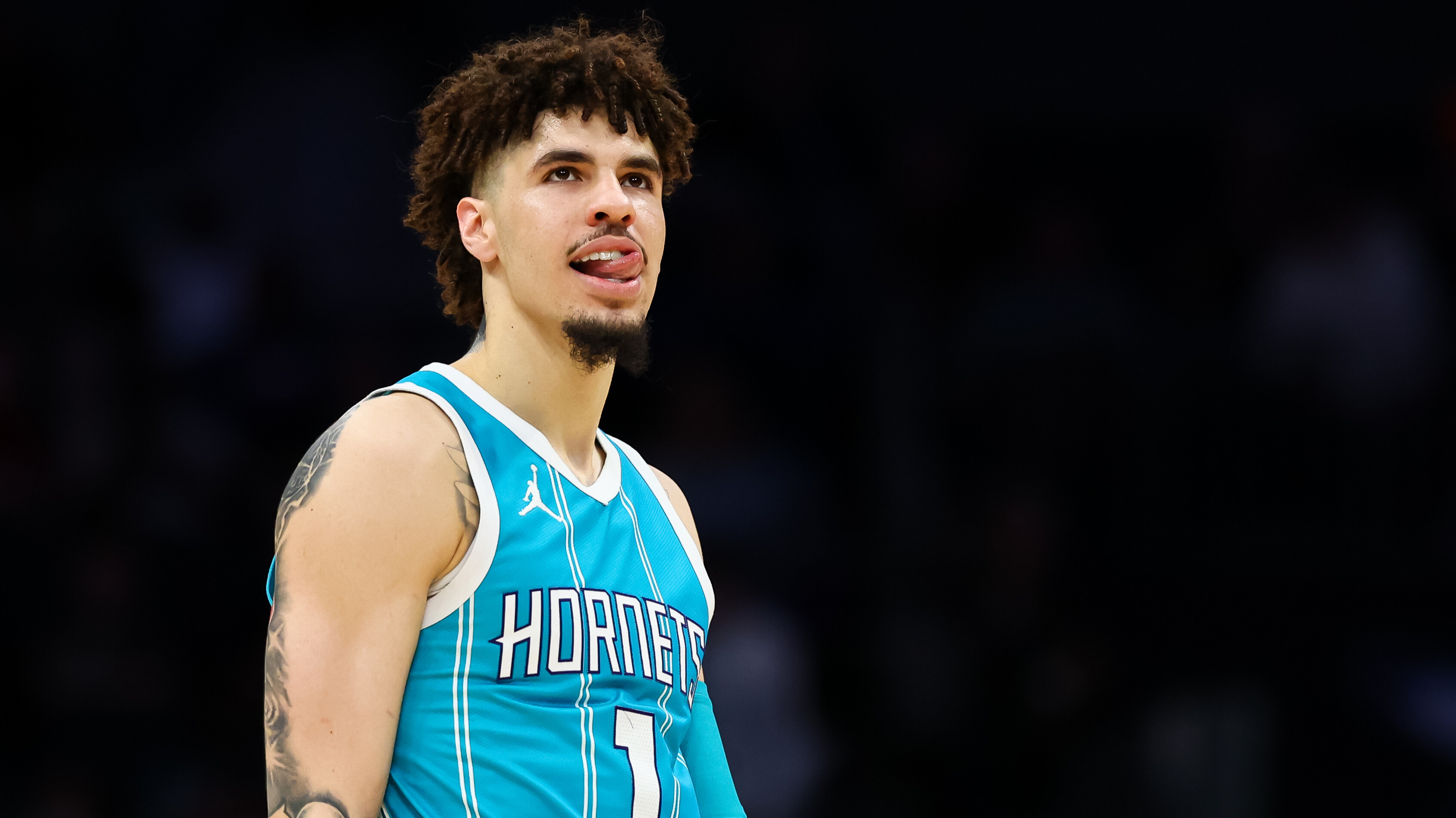 LaMelo Ball #1 of the Charlotte Hornets looks on during the second half of a basketball game against the Orlando Magic at Spectrum Center on March 25, 2025 in Charlotte, North Carolina.