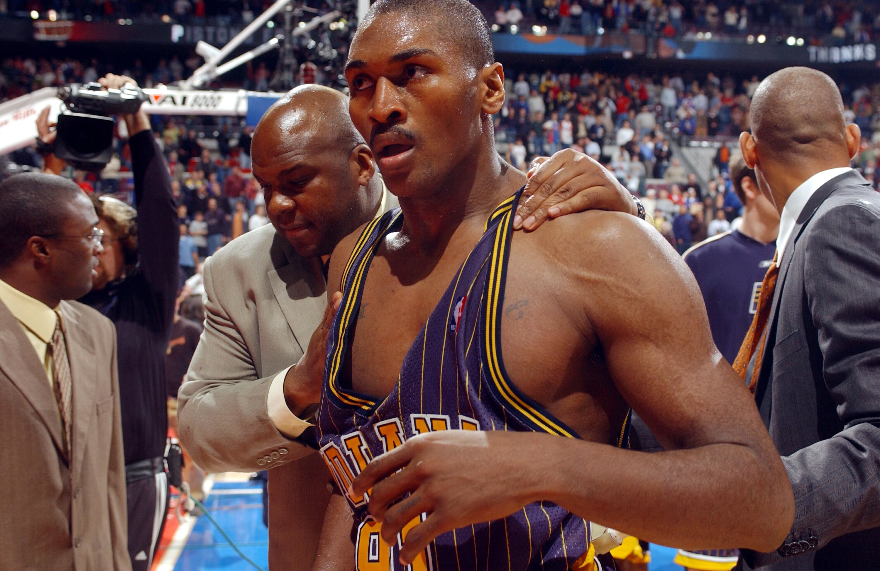 Ron Artest leaves the court following the Malice at the Palace.