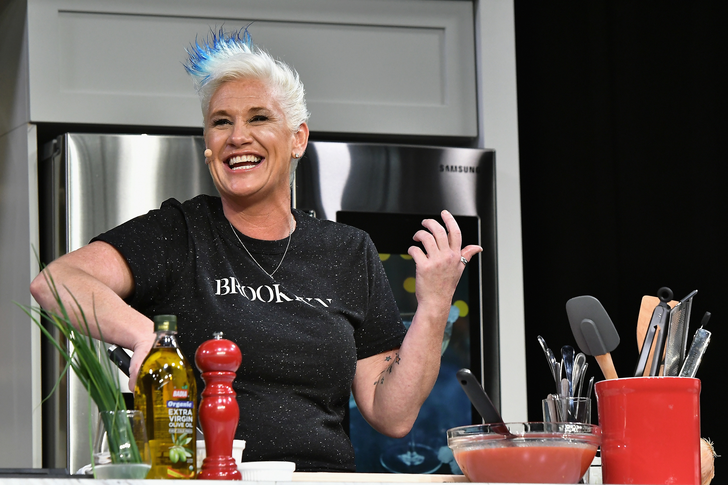Chef Anne Burrell prepares a dish at the Food Network & Cooking Channel New York City Wine & Food Festival in 2017.