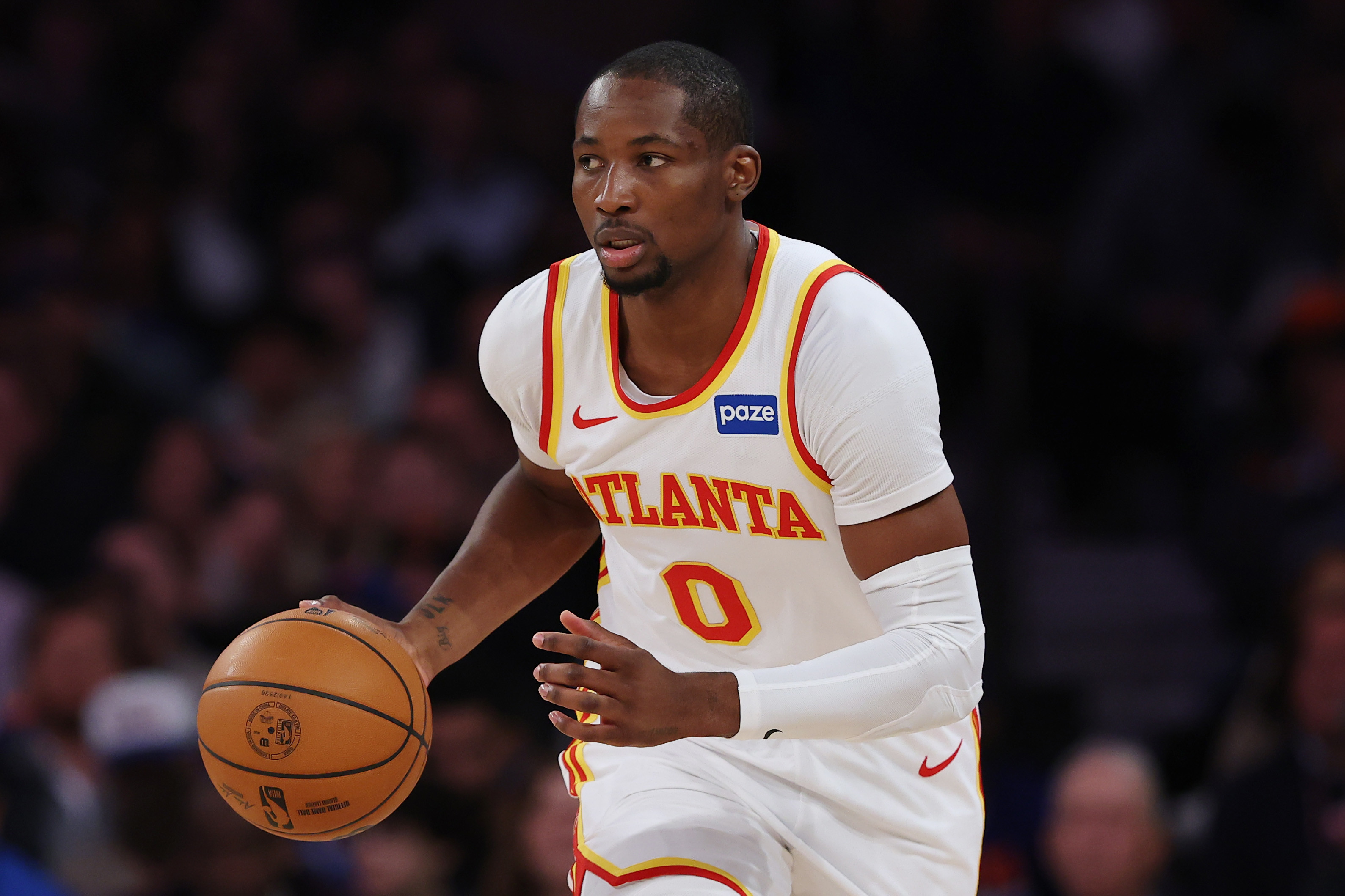 Jonathan Kuminga dribbles the ball up the court during a Hawks-Knicks game in the 2026 NBA Playoffs. 