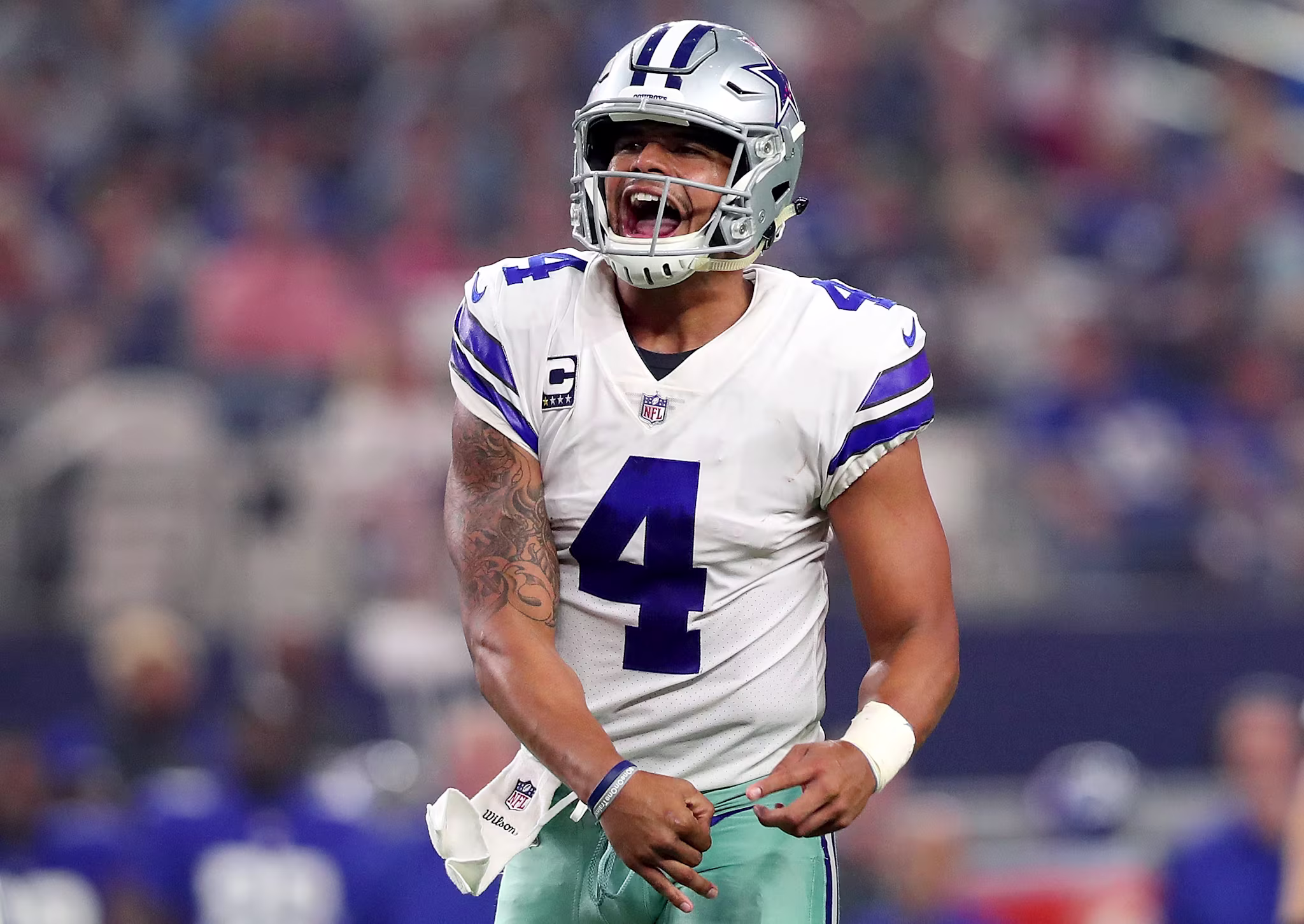 Dak Prescott celebrates a touchdown during a Dallas Cowboys game. 