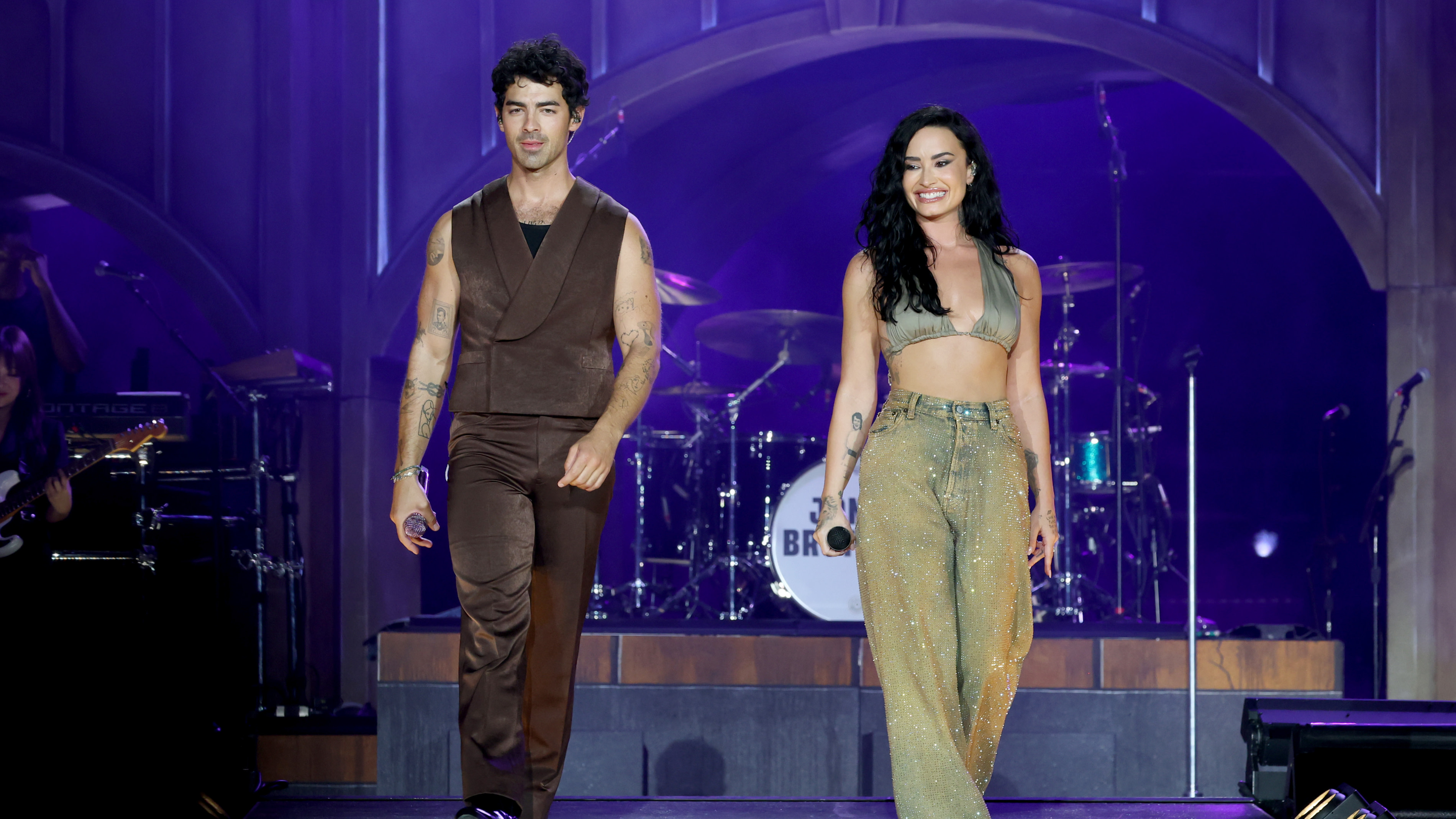 Joe Jonas and Demi Lovato perform onstage during the Jonas Brothers: JONAS20 Greetings From Your Hometown tour kick off.