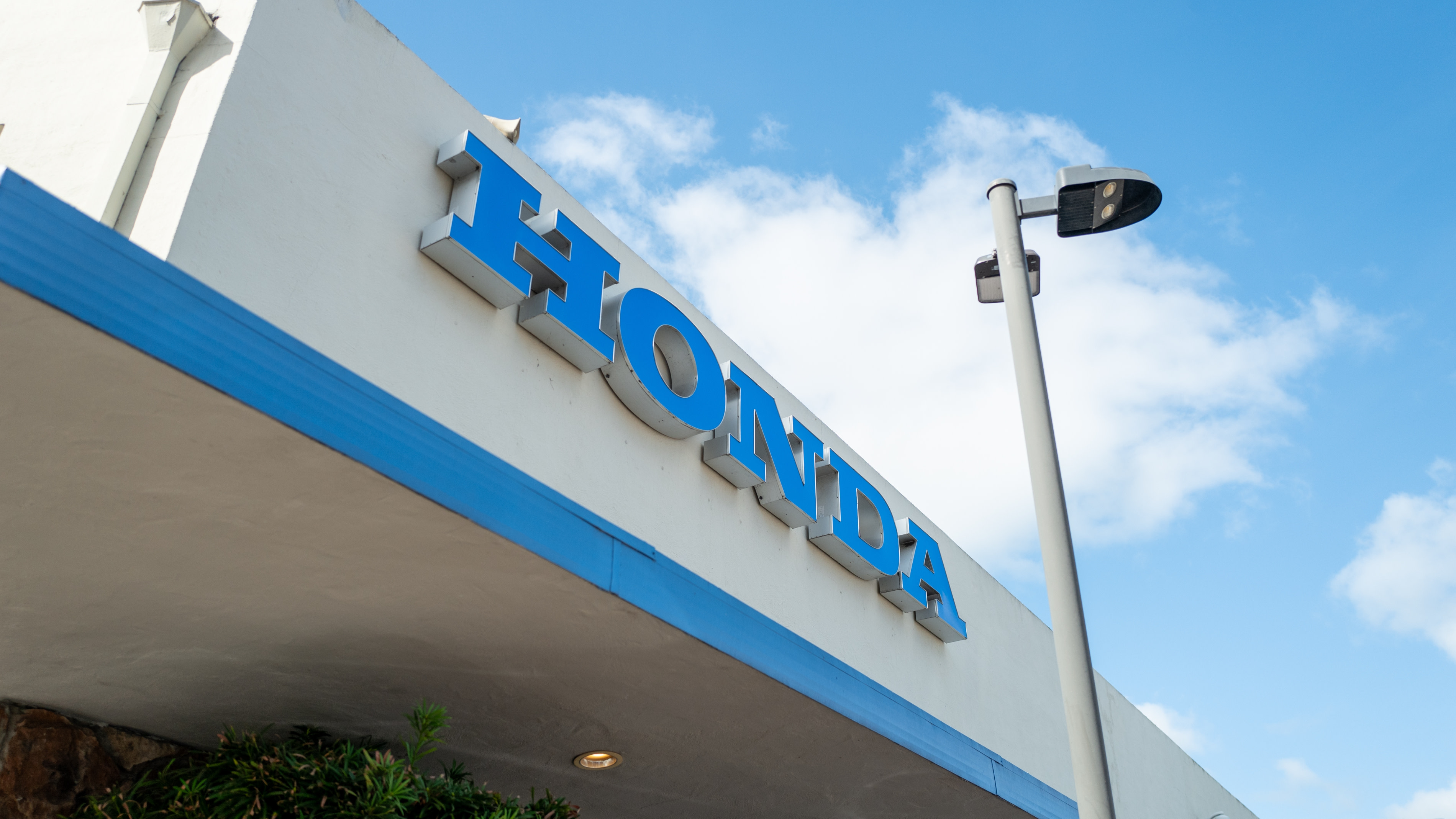 Honda logo is visible on facade of dealership in Walnut Creek, California.