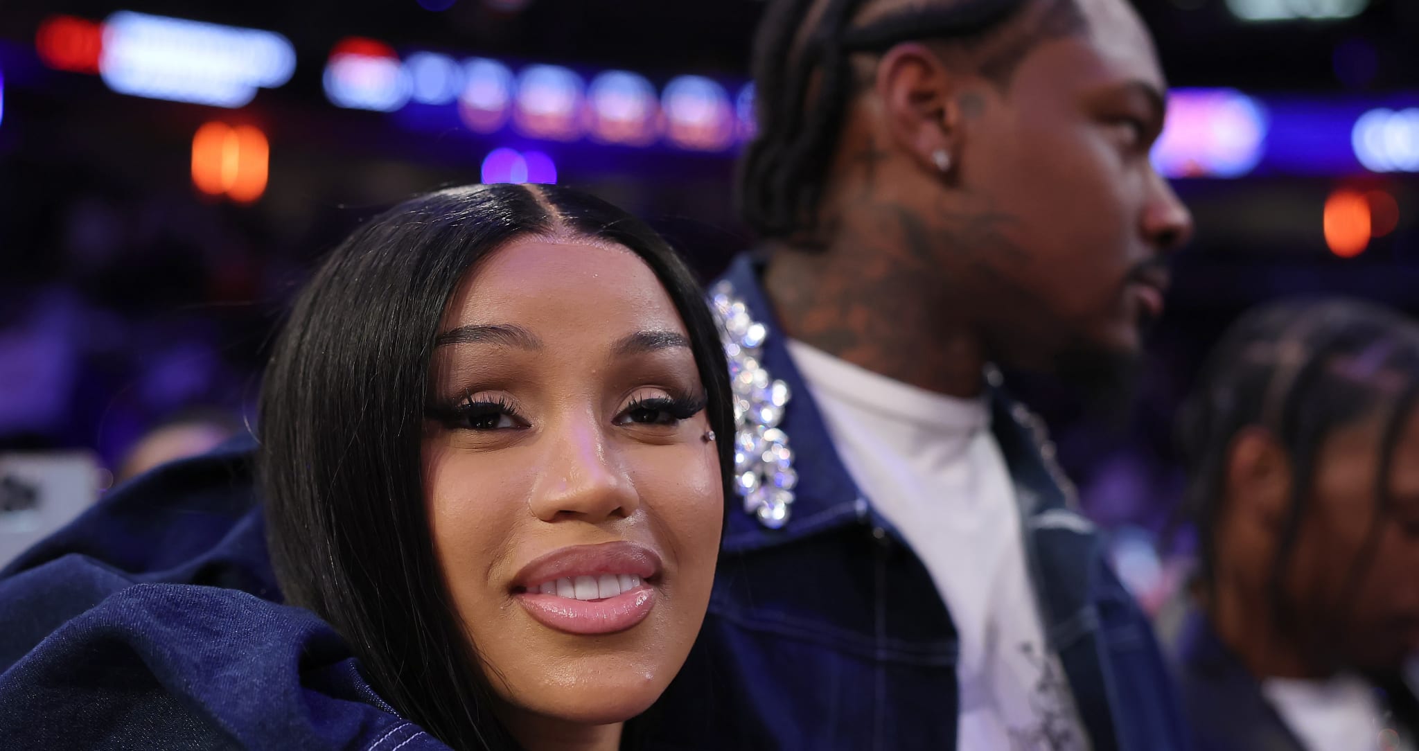 NFL Player Stefon Diggs (R) and rapper Cardi B (L) celebrate after Game Four of the Eastern Conference Second Round NBA Playoffs between the Boston Celtics and the New York Knicks at Madison Square Garden on May 12, 2025 in New York City. 