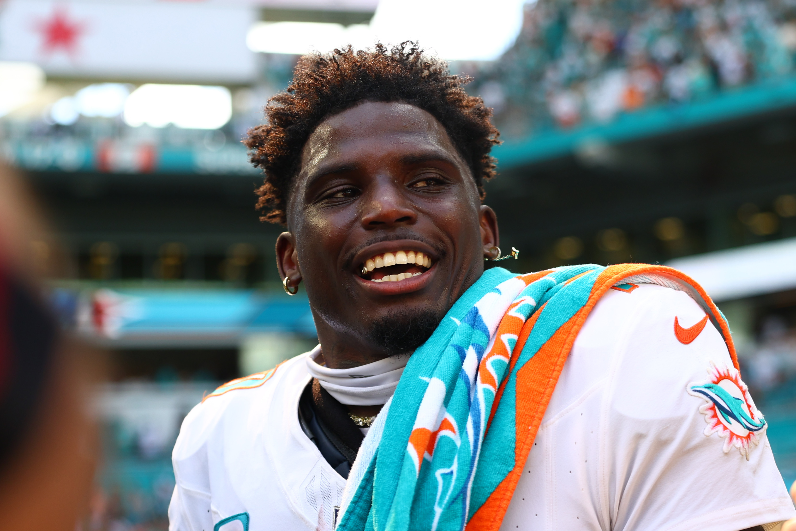 Tyreek Hill smiles prior to a Miami Dolphins game in September 2024. 