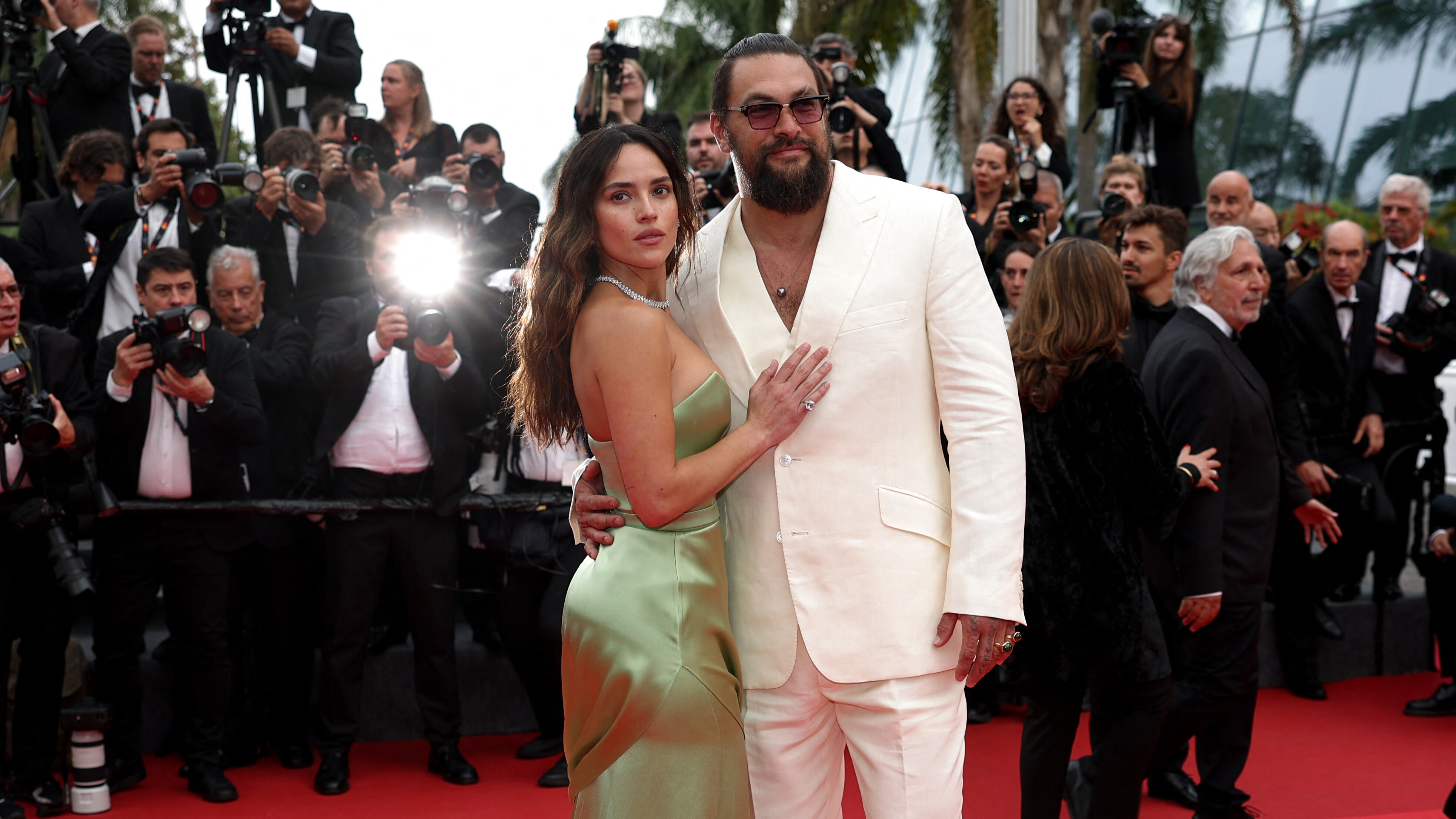 US actress Adria Arjona and US actor Jason Momoa arrive for the screening of the film "Splitsville" at the 78th edition of the Cannes Film Festival in Cannes, southern France, on May 19, 2025.