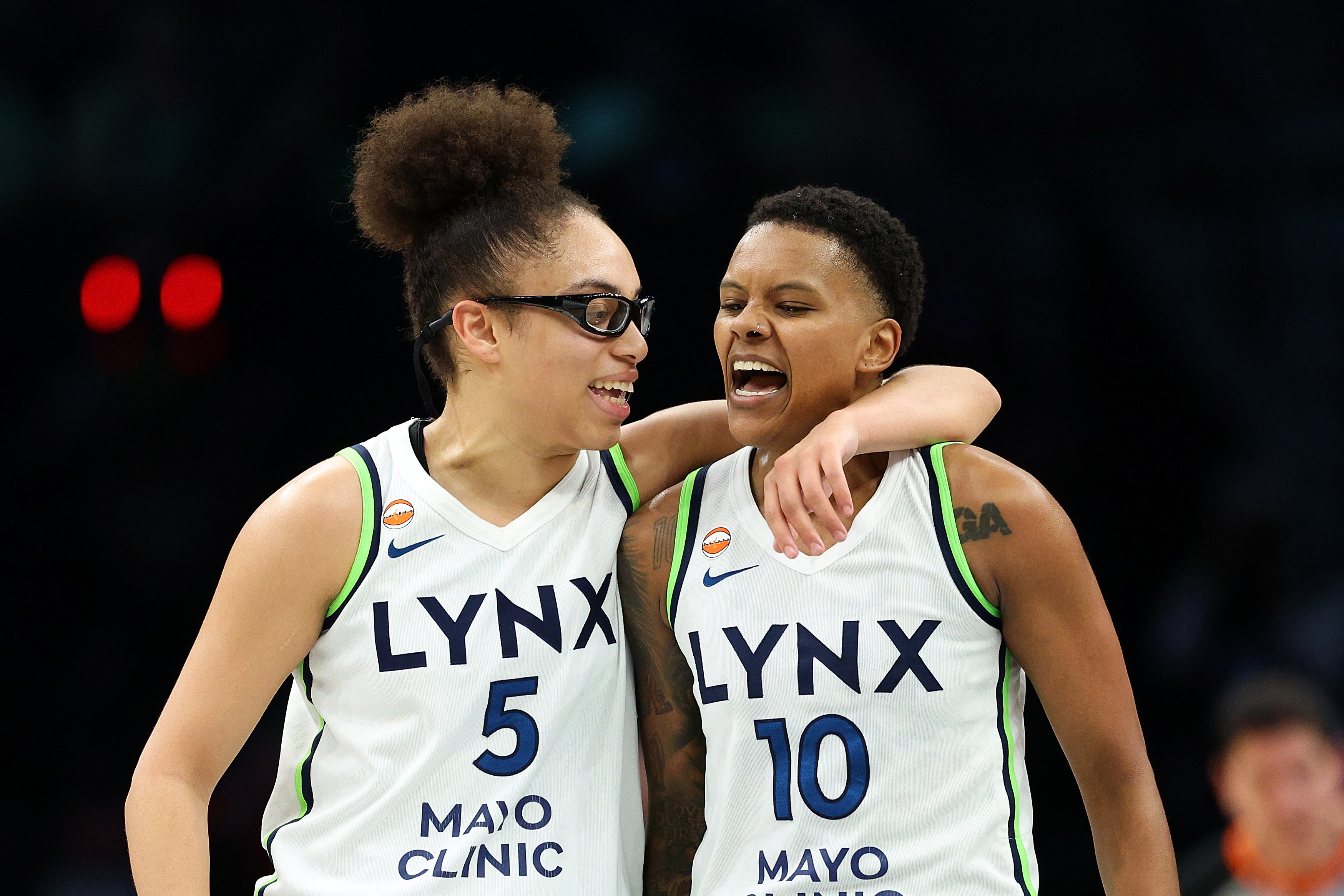 Olivia Miles and Courtney Williams celebrate during the Minnesota Lynx-Dallas Wings game in June 2026. 