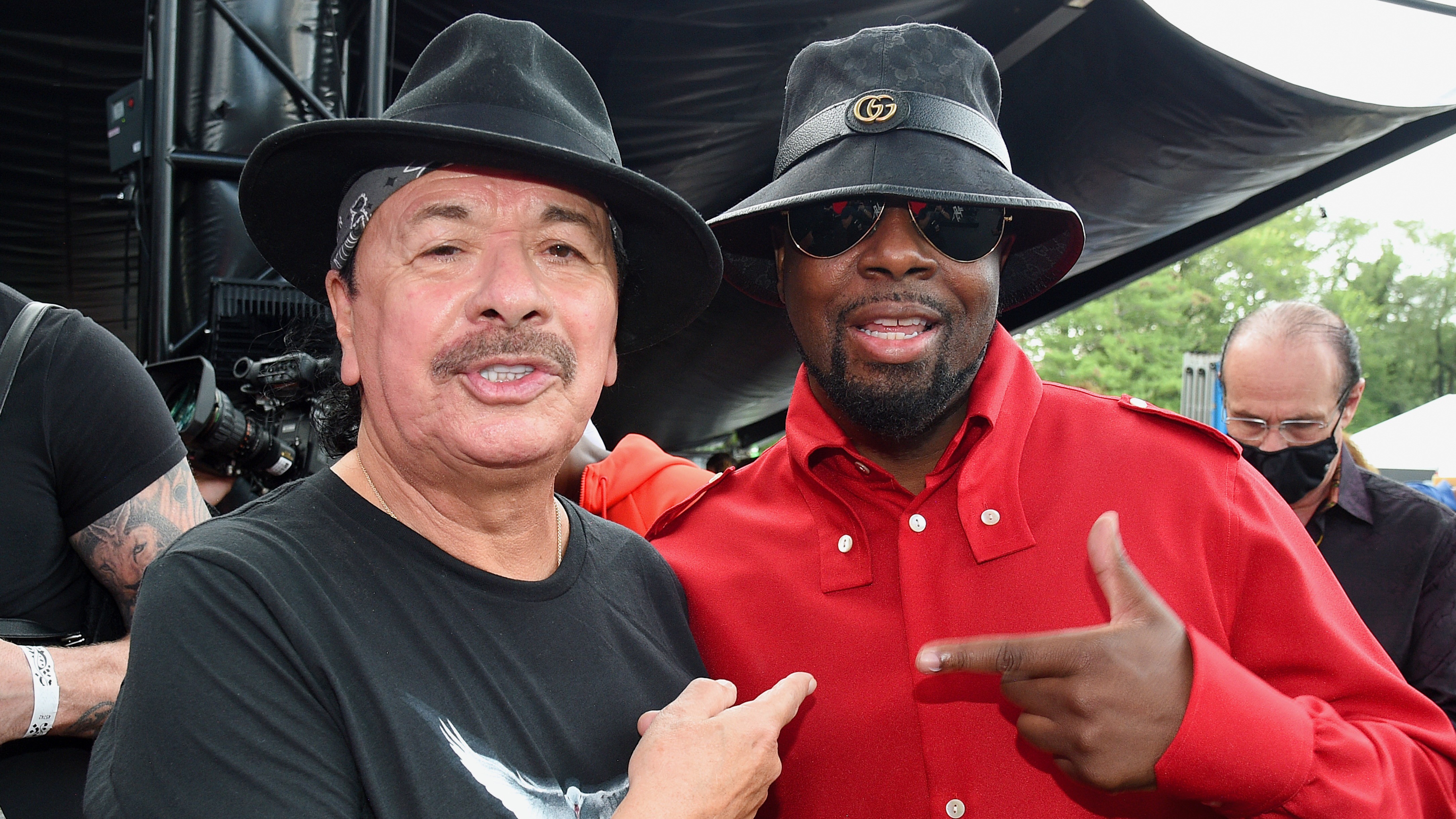 (L-R) Carlos Santana and Wyclef Jean.