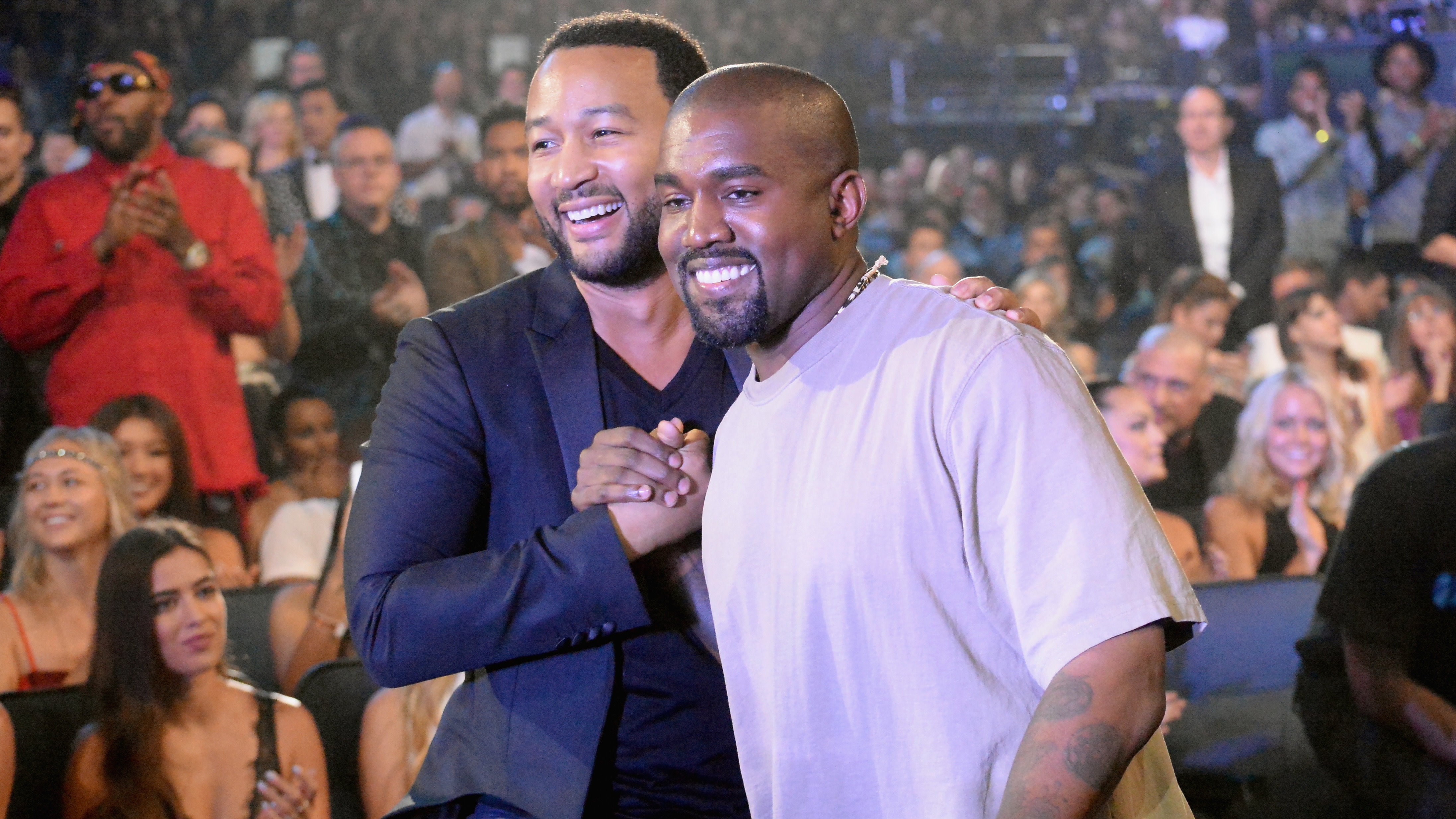 (L-R) John Legend and Kanye West.