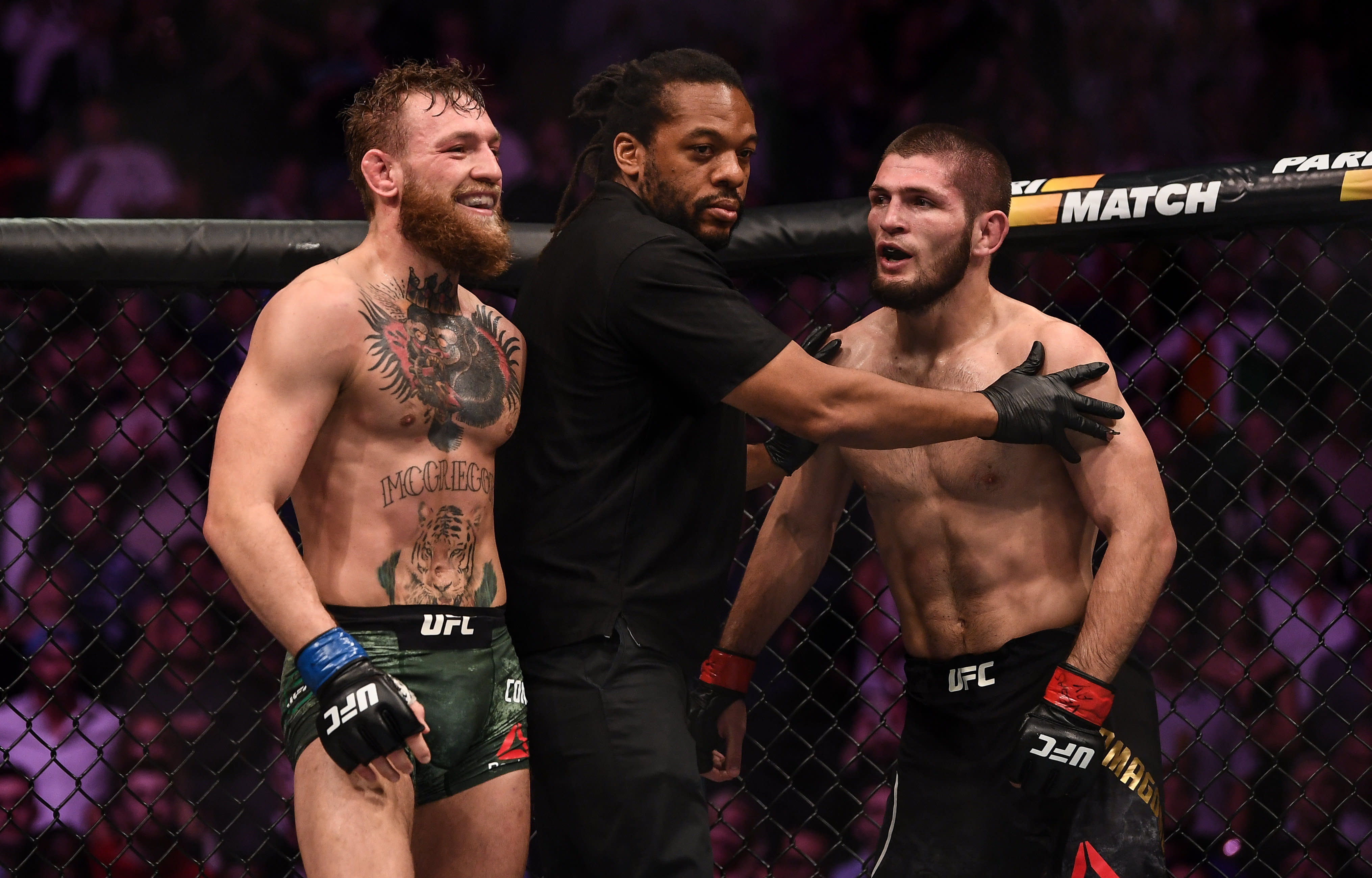 Conor McGregor, left, in action against Khabib Nurmagomedov in their UFC lightweight championship fight during UFC 229 at T-Mobile Arena in Las Vegas, Nevada, USA.