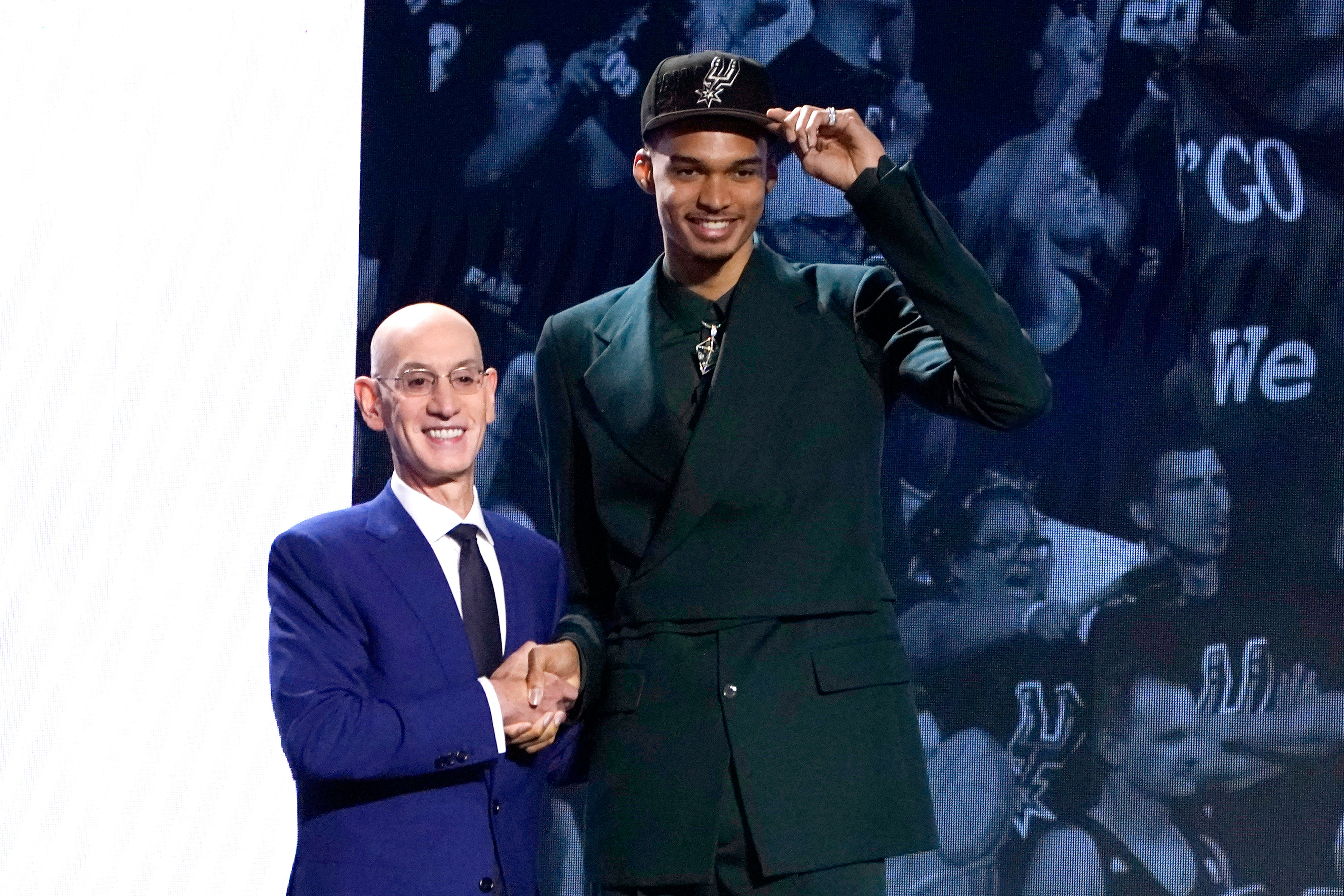 Victor Wembanyama shakes hands with NBA commissioner Adam Silver at the 2023 NBA Draft. 