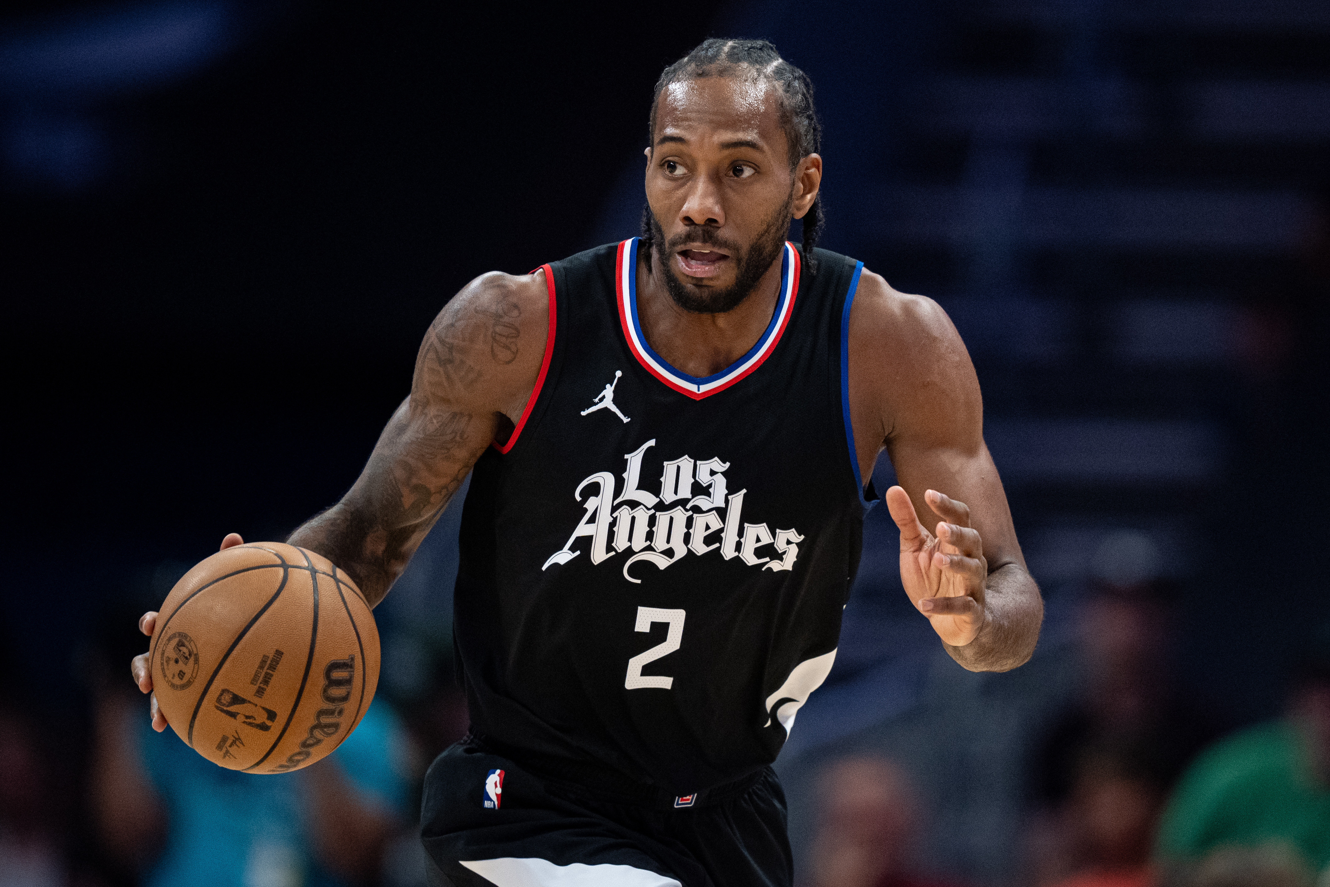 Kawhi Leonard dribbles up the court during a Los Angeles Clippers-Charlotte Hornets game from 2025. 