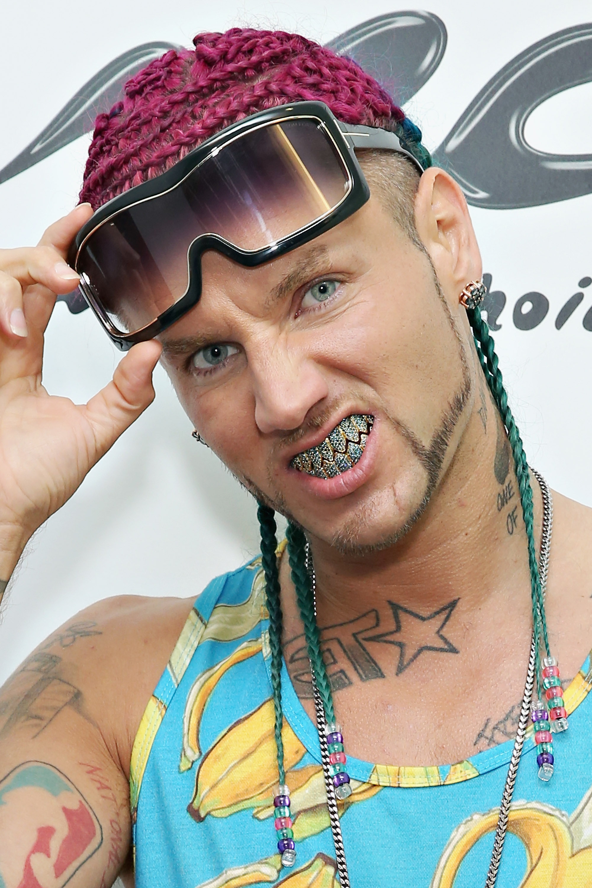 Riff Raff wearing shark tooth grills