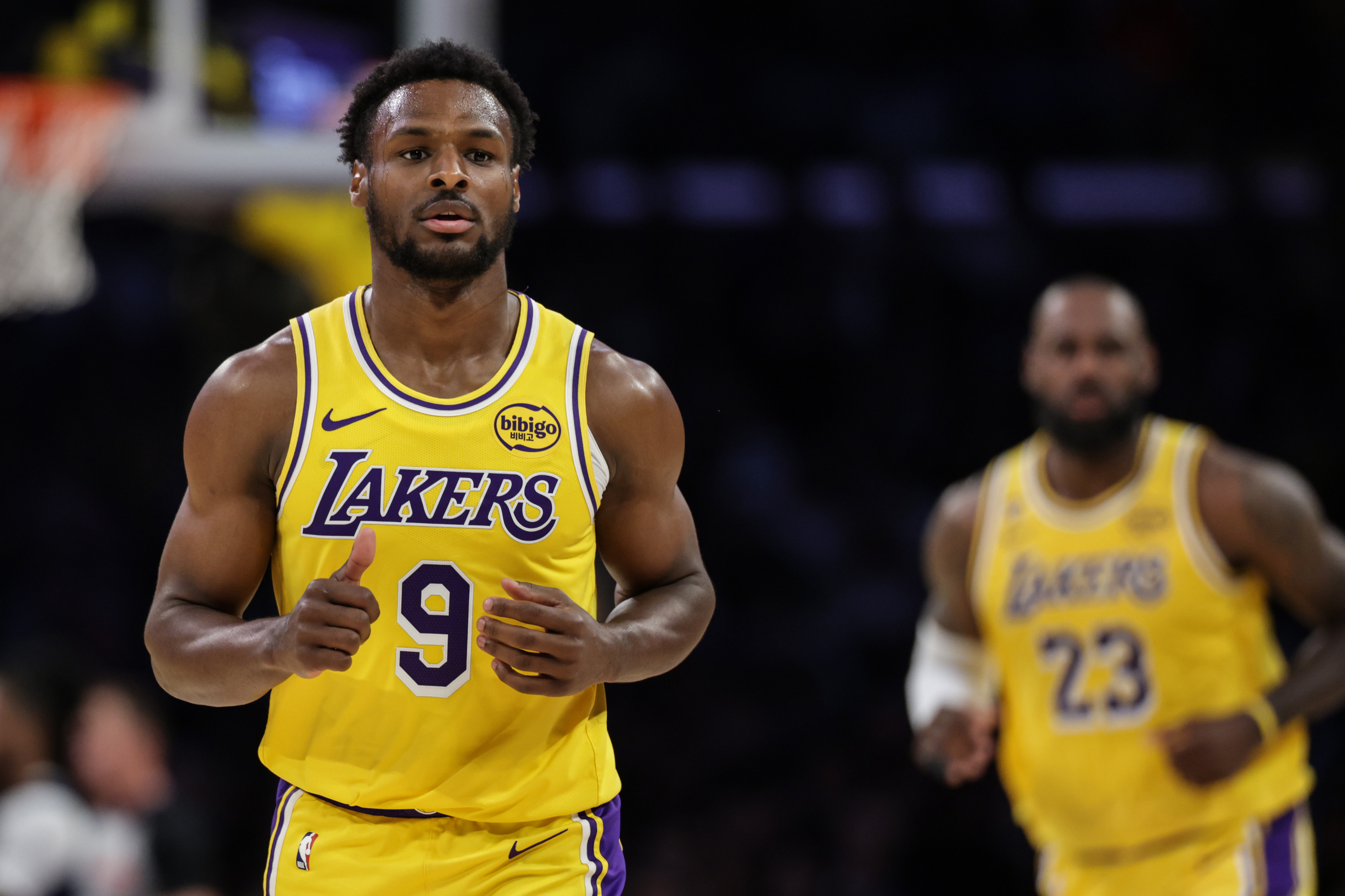 Bronny James hustles back on defense during a Lakers-Wizards game in March 2026. 