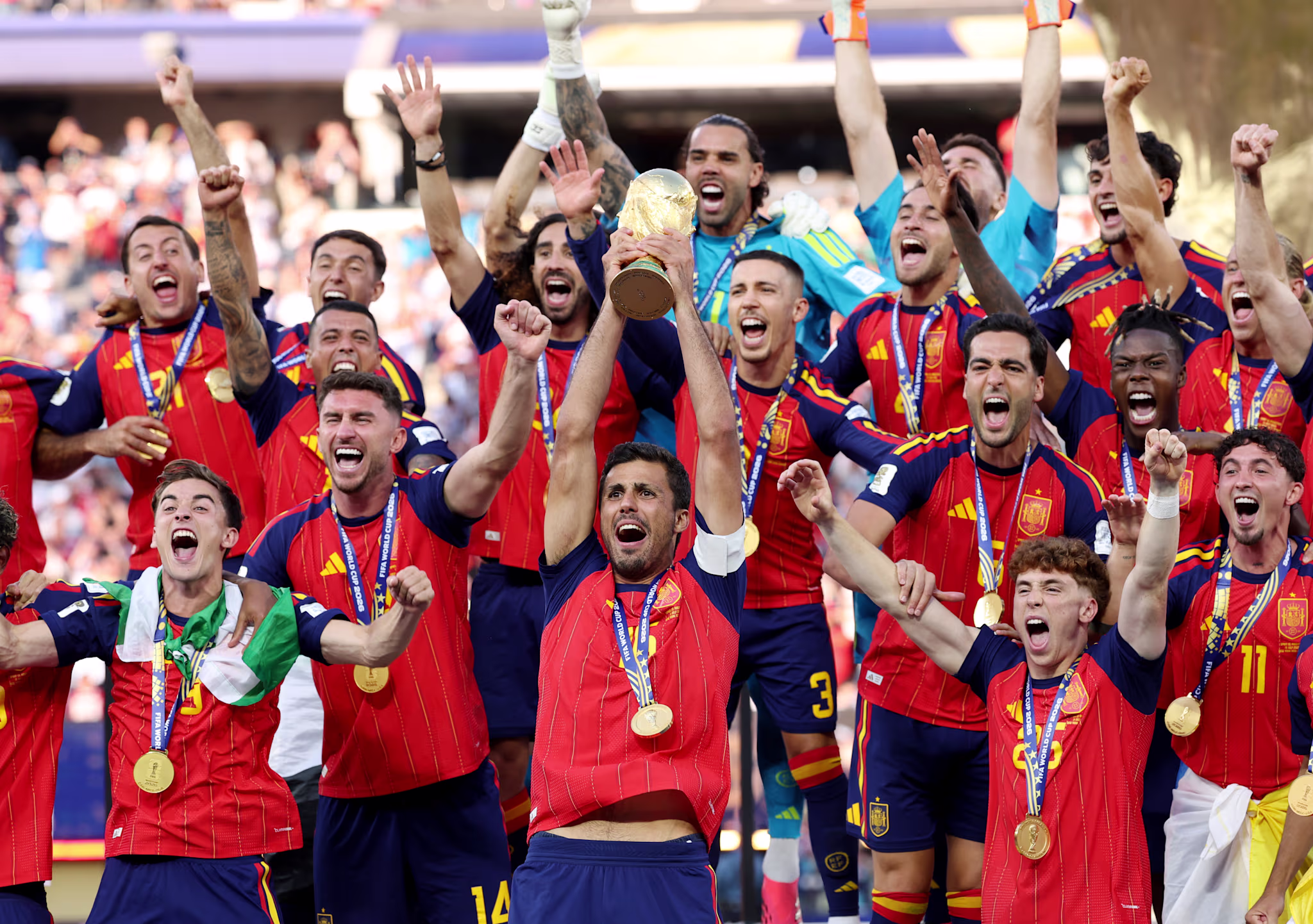 Rodri lifts the World Cup trophy following Spain's 1-0 victory over Argentina in the finals of the 2026 FIFA World Cup. 