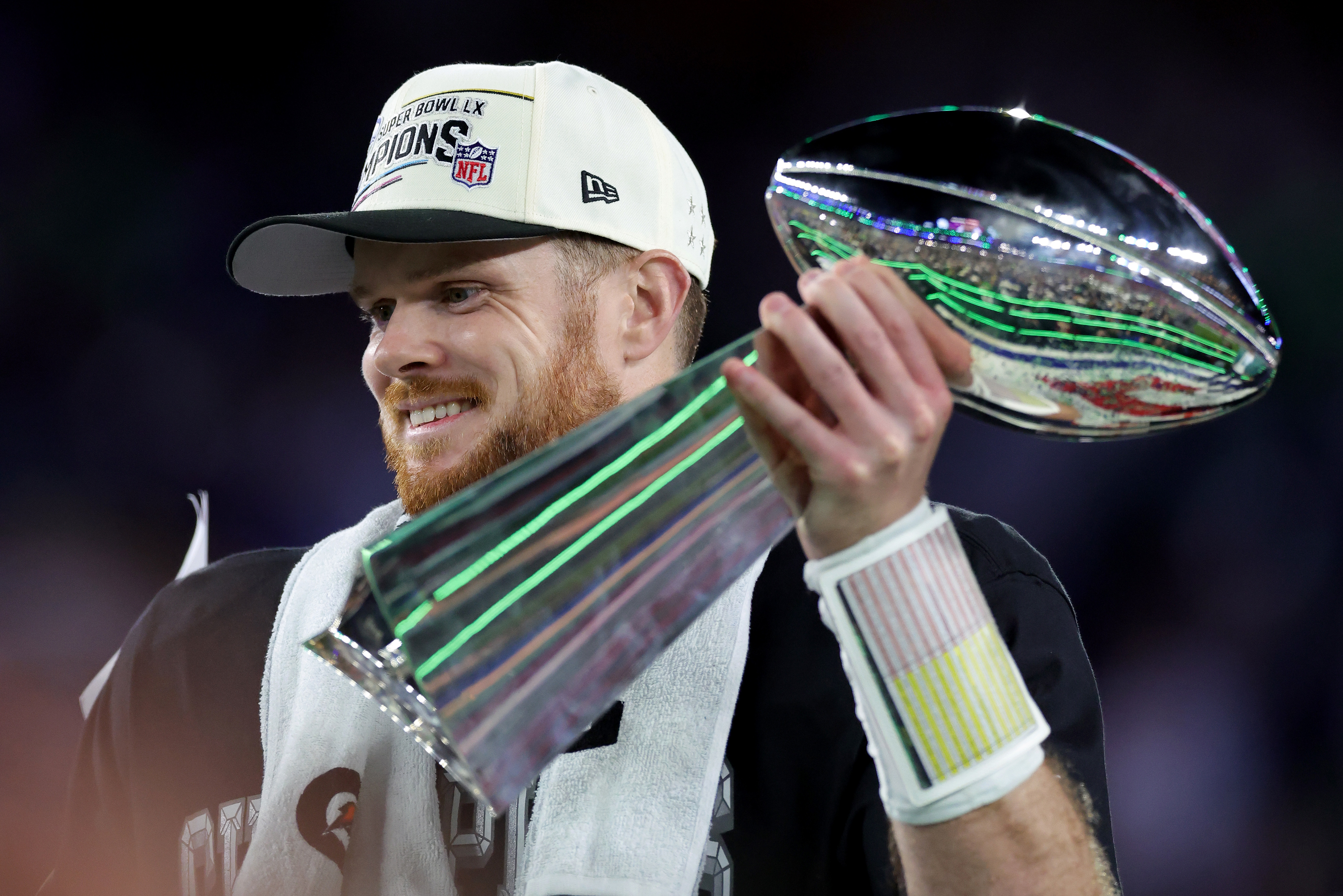 Sam Darnold clutches the Vince Lombardi Trophy after the Seattle Seahawks won the Super Bowl in February 2026. 