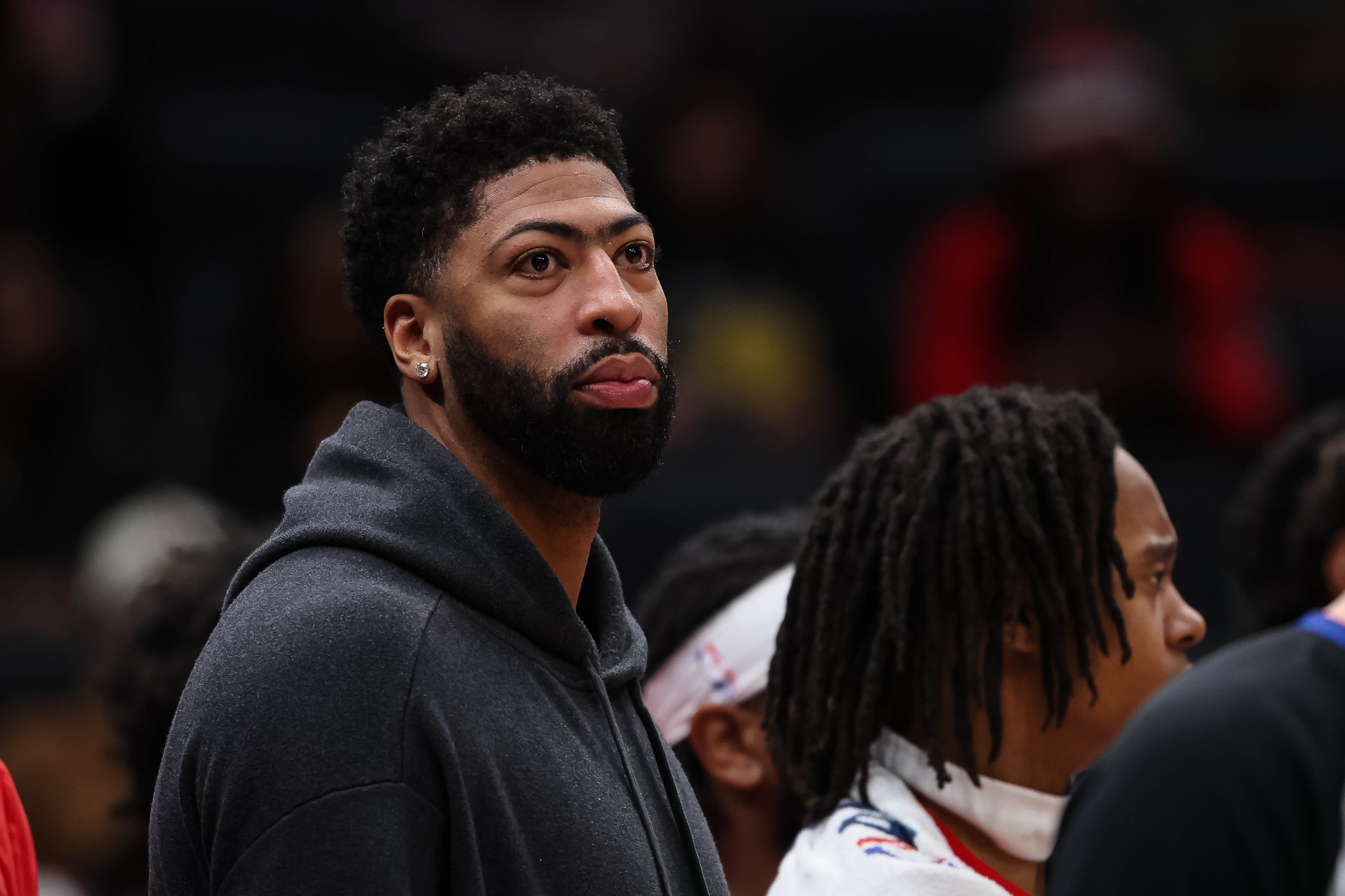 Anthony Davis sits on the sidelines in street clothes during a Washington Wizards game from February 2026.