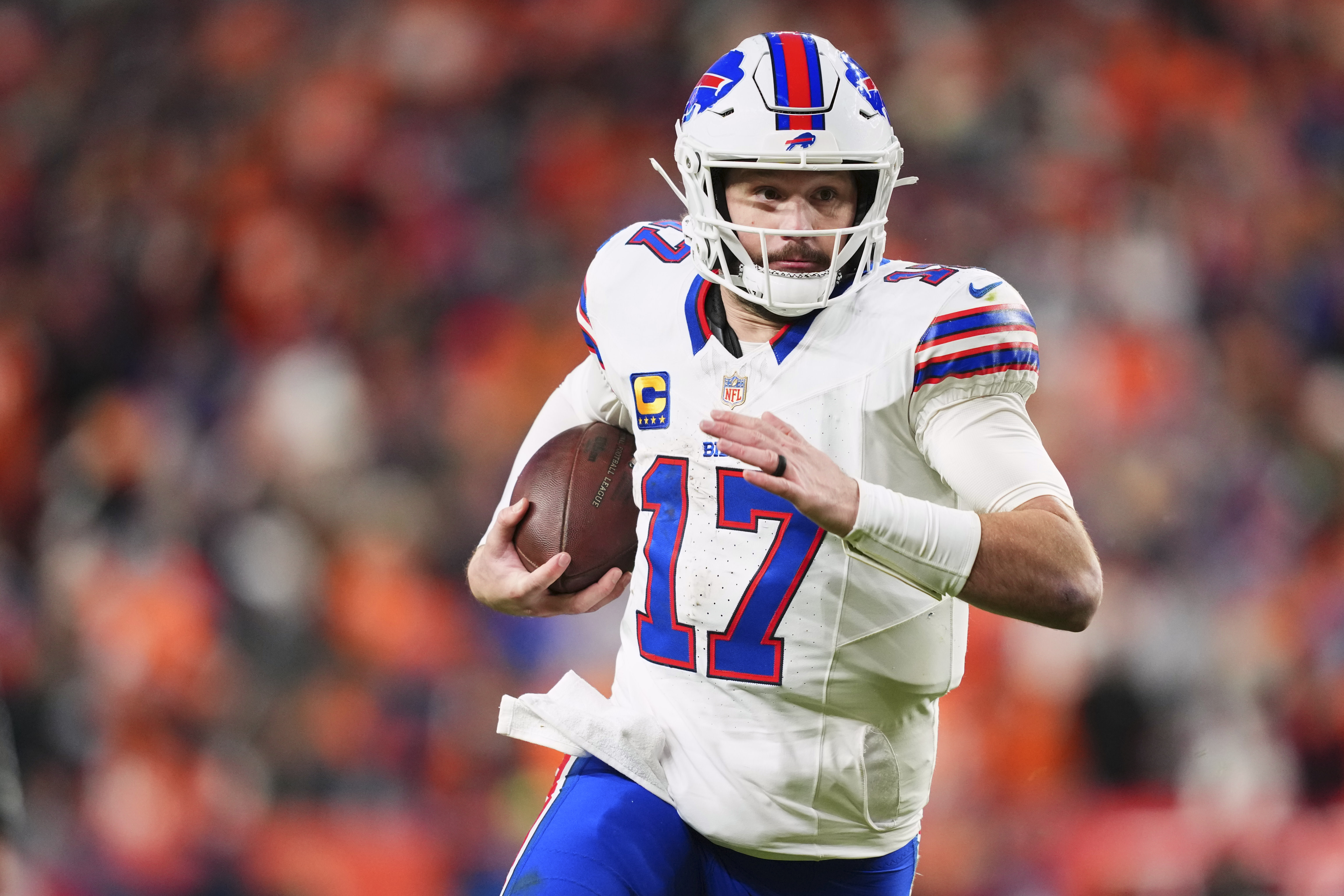 Buffalo Bills QB Josh Allen scrambles for a run during his playoff defeat to the Denver Broncos. 