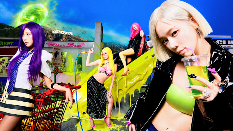Four women with vibrant hair colors and stylish outfits in a colorful, surreal setting with neon accents and a shopping cart.