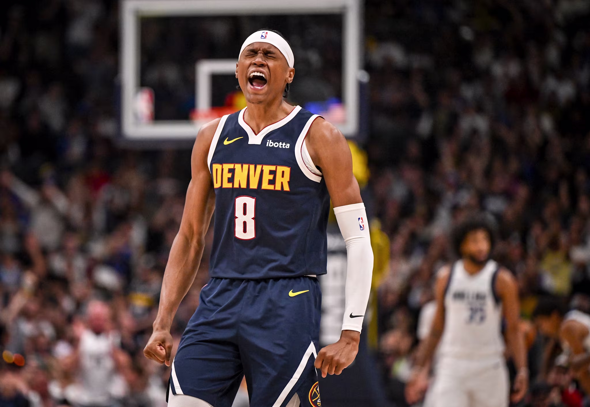 Peyton Watson celebrates after making a 3-pointer during the Nuggets win over the Dallas Mavericks. 