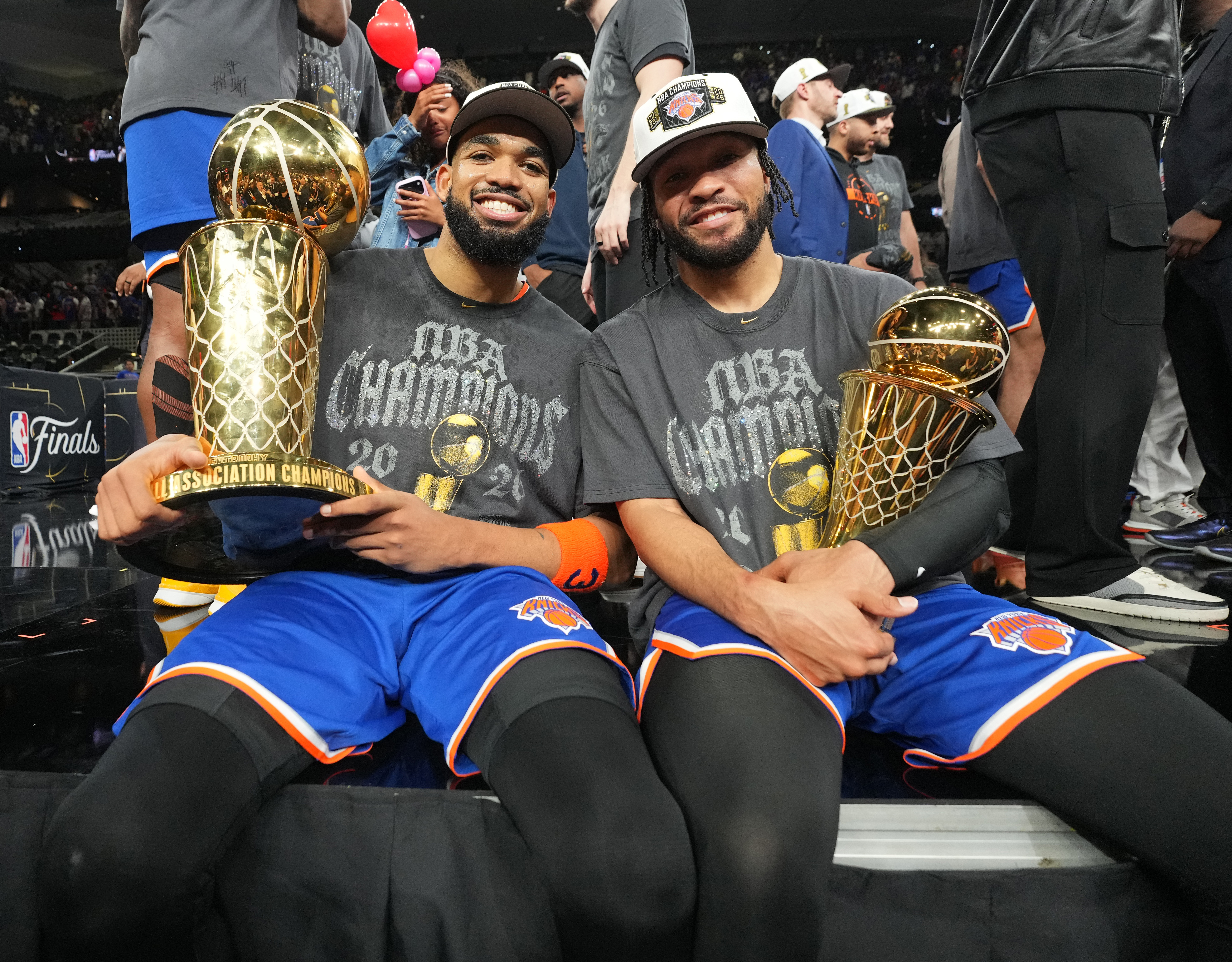 Karl-Anthony Towns and Jalen Brunson celebrate after winning the 2026 NBA Championship. 