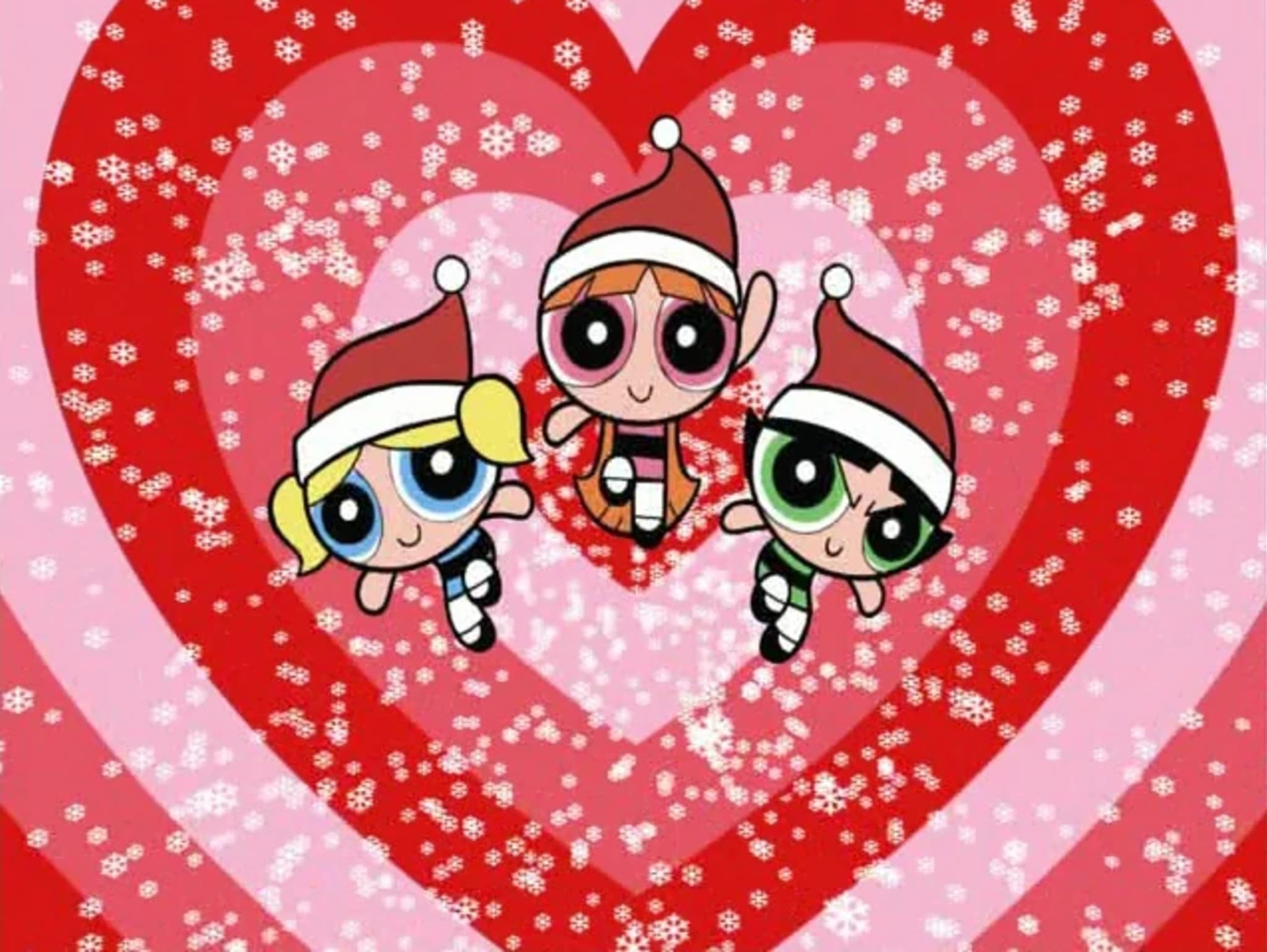The Powerpuff Girls in Santa hats, surrounded by red hearts and snowflakes.