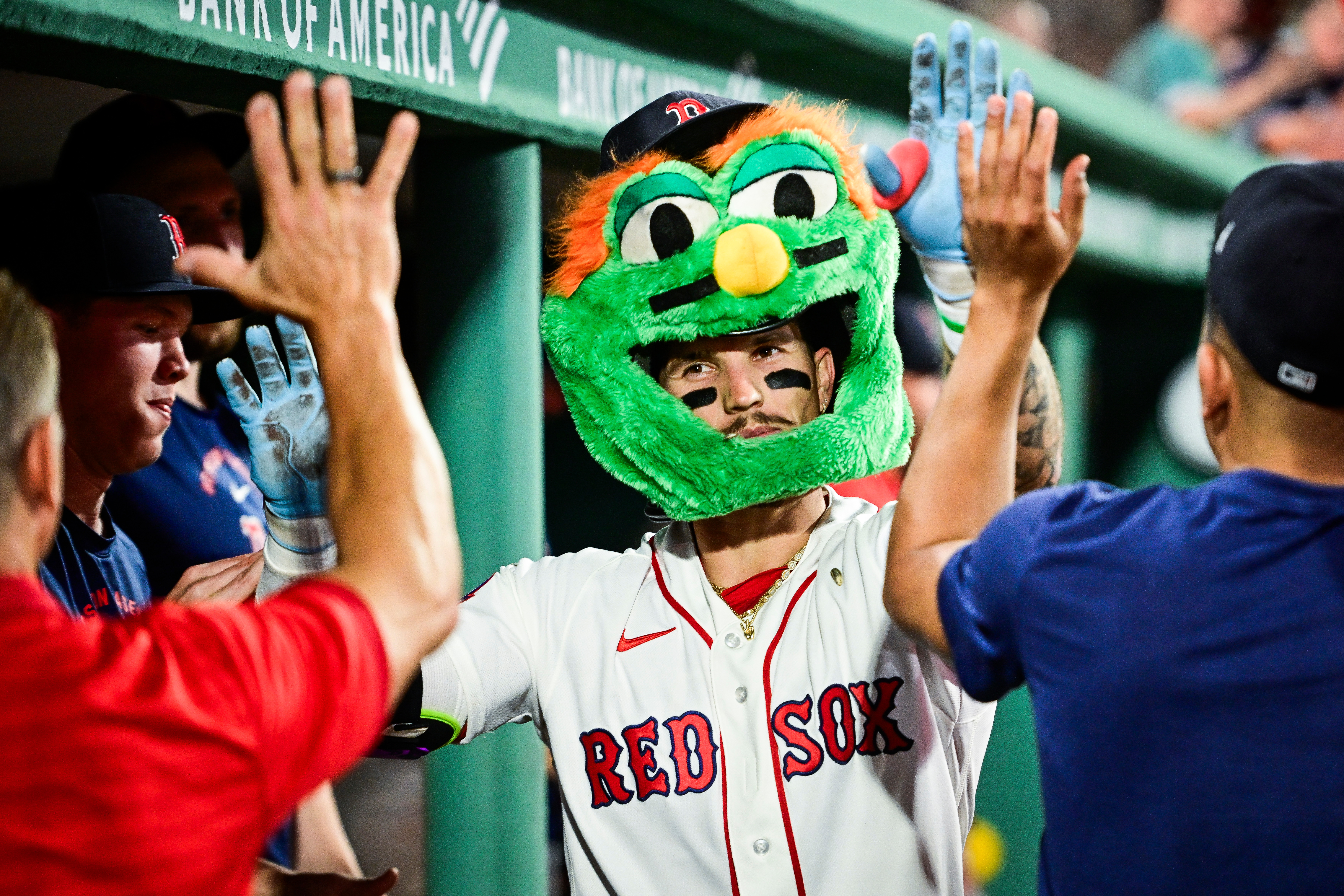 Jarren Duren and the Boston Red Sox celebrate a home run with a Wally helmet.
