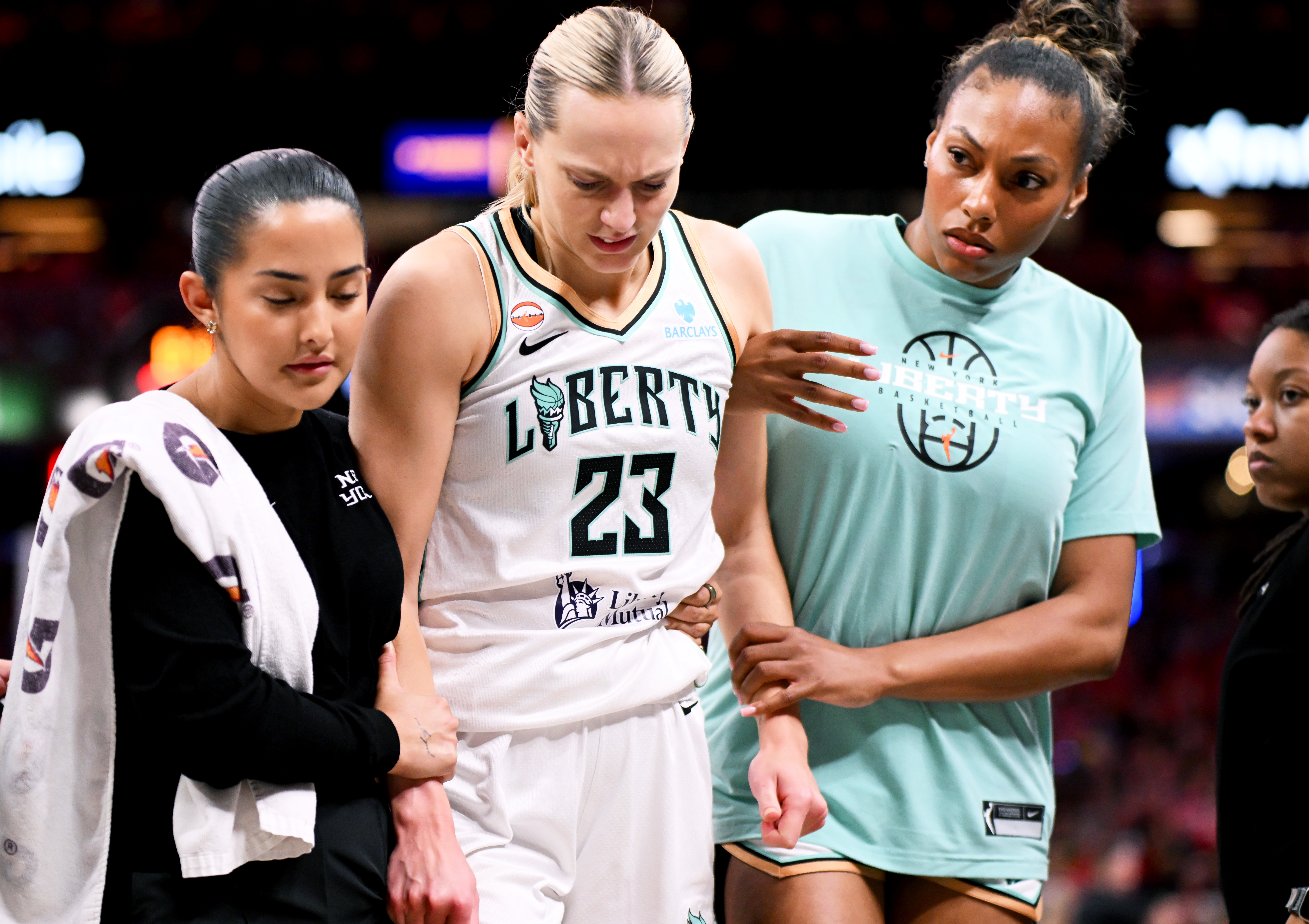 Marine Johannes is helped off the court during the Liberty's game against the Indiana Fever on July 18. 