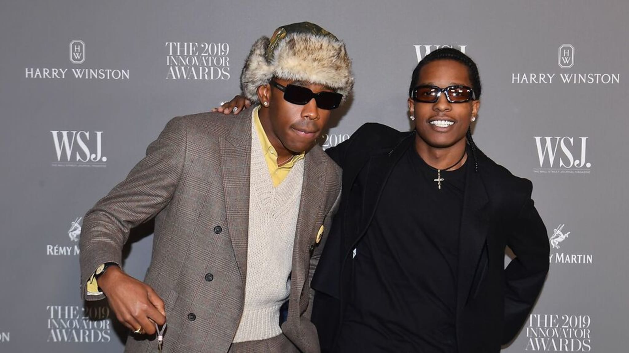 Tyler, the Creator in a fur hat and sunglasses, and A$AP Rocky in a black outfit and sunglasses, at the 2019 Innovator Awards.