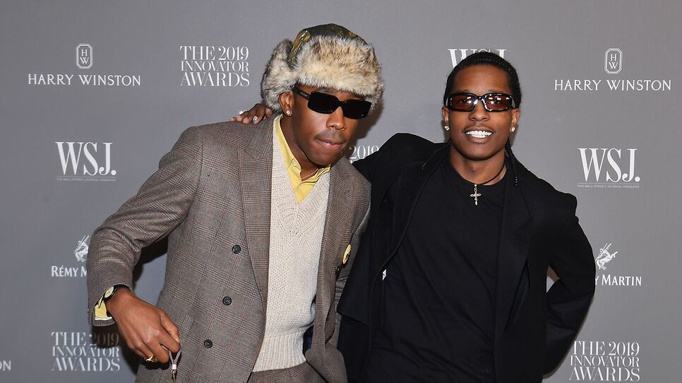 Tyler, the Creator in a fur hat and sunglasses, and A$AP Rocky in a black outfit and sunglasses, at the 2019 Innovator Awards.