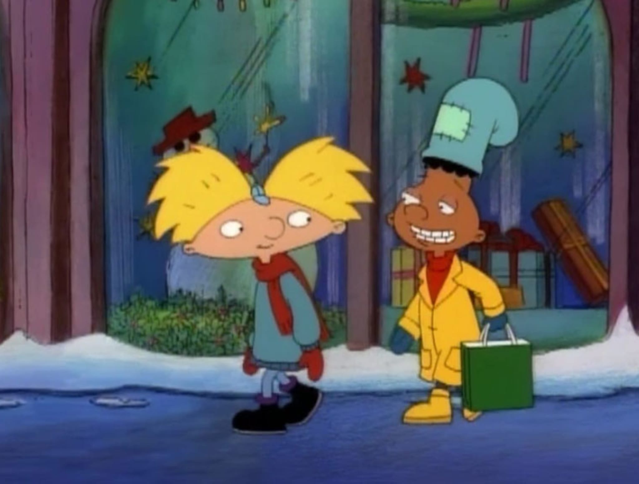 Animated characters Arnold and Gerald from 'Hey Arnold!' walking in winter attire on a snowy street.