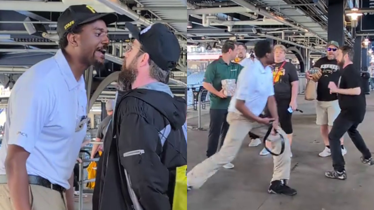 A heated confrontation between a Pittsburgh Pirates game day employee and a fan. Other people are watching the altercation unfold in the background.