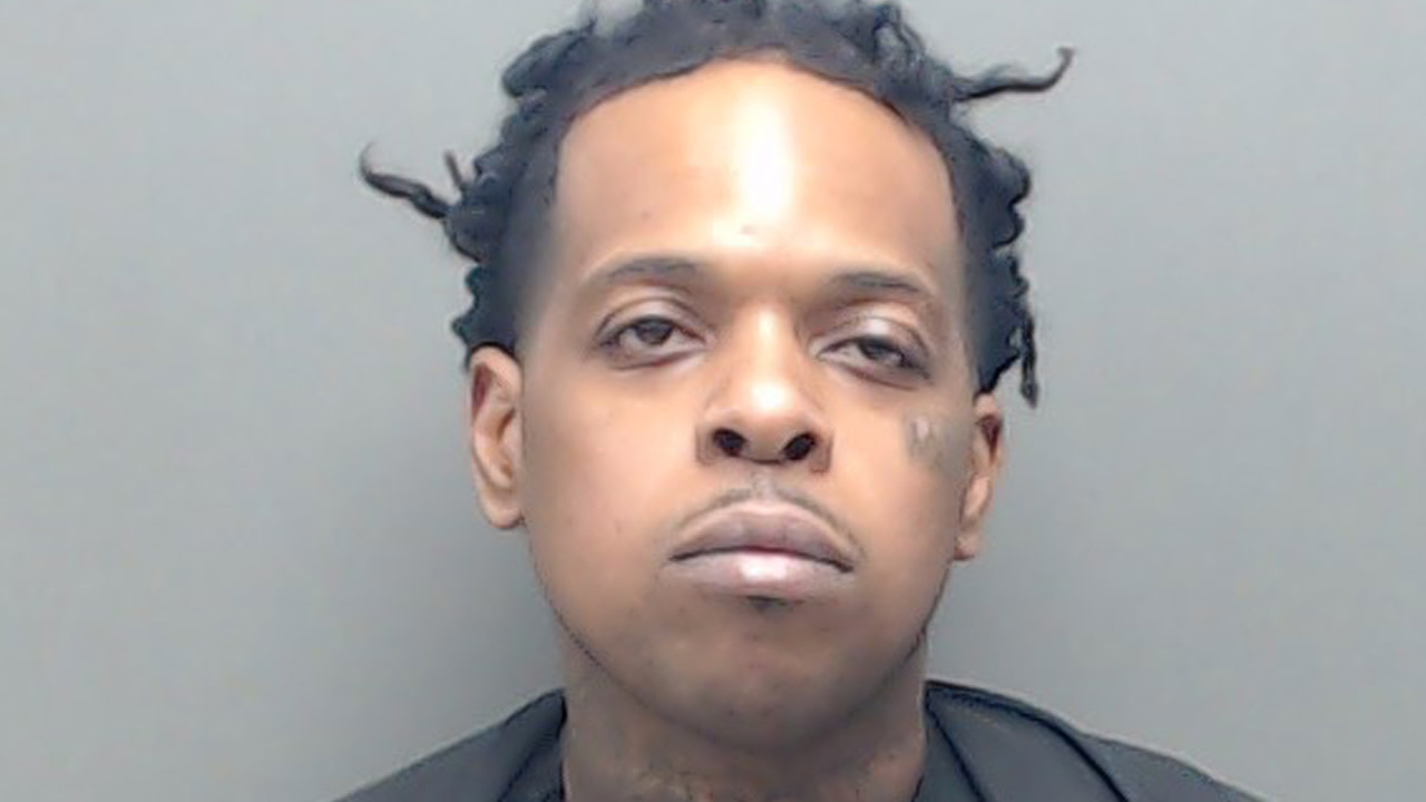Finesse2Tymes in a mugshot.