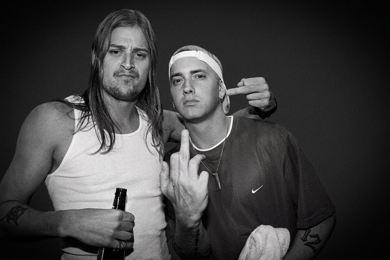 Kid Rock and Eminem pose together, both making gestures. Kid Rock holds a drink, while Eminem wears a red shirt and white cap.