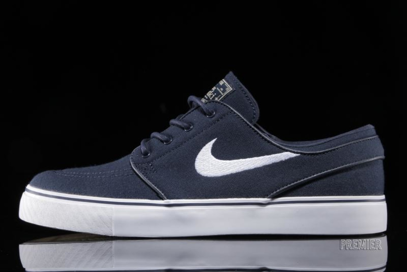 white and blue janoskis