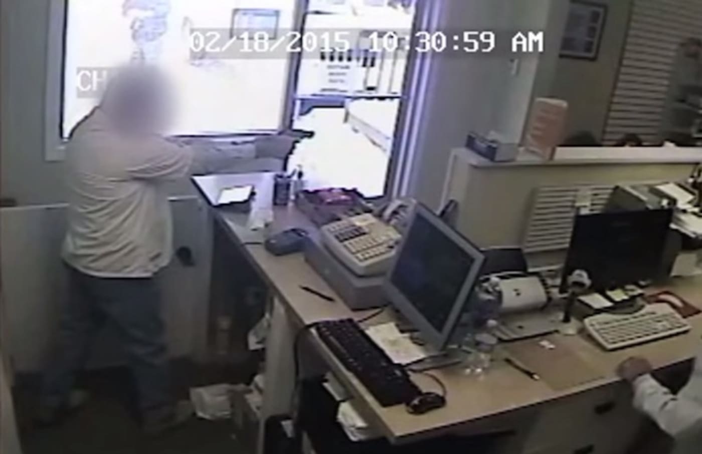 Surveillance Footage Shows Pharmacist Fatally Shooting Armed Robber in