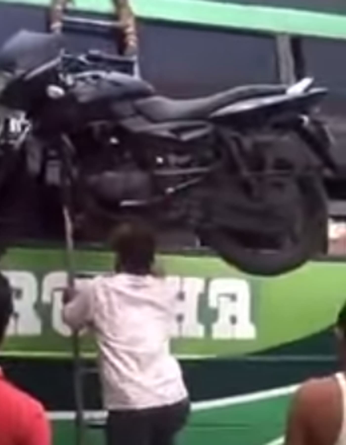 Moving a Motorcycle on Your Head Is the Best and Only Way To Move a